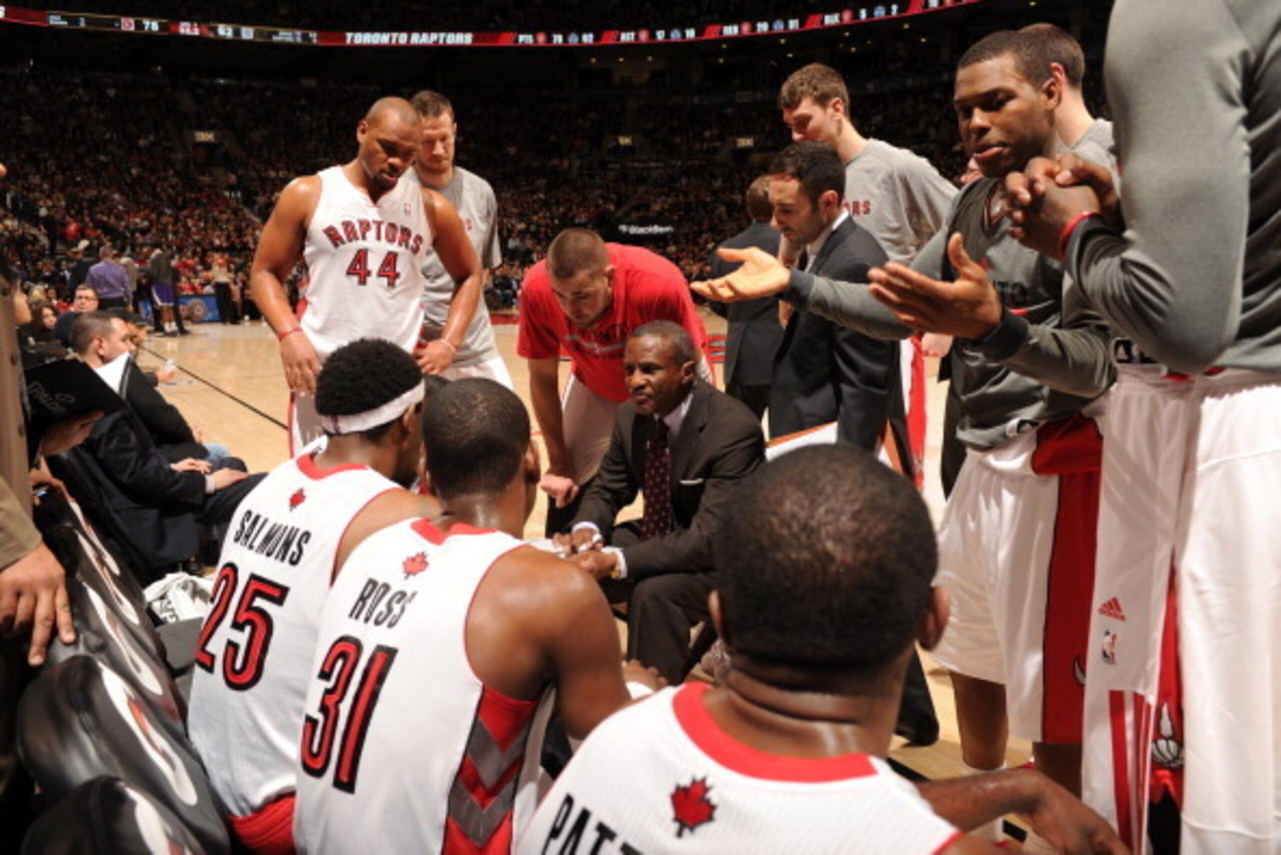 TORONTO, CANADA - March 7:  Dwane Casey of the Toronto Raptors huddles his team up during the game against the Sacramento Kings on March 7, 2014 at the Air Canada Centre in Toronto, Ontario, Canada.  NOTE TO USER: User expressly acknowledges and agrees th