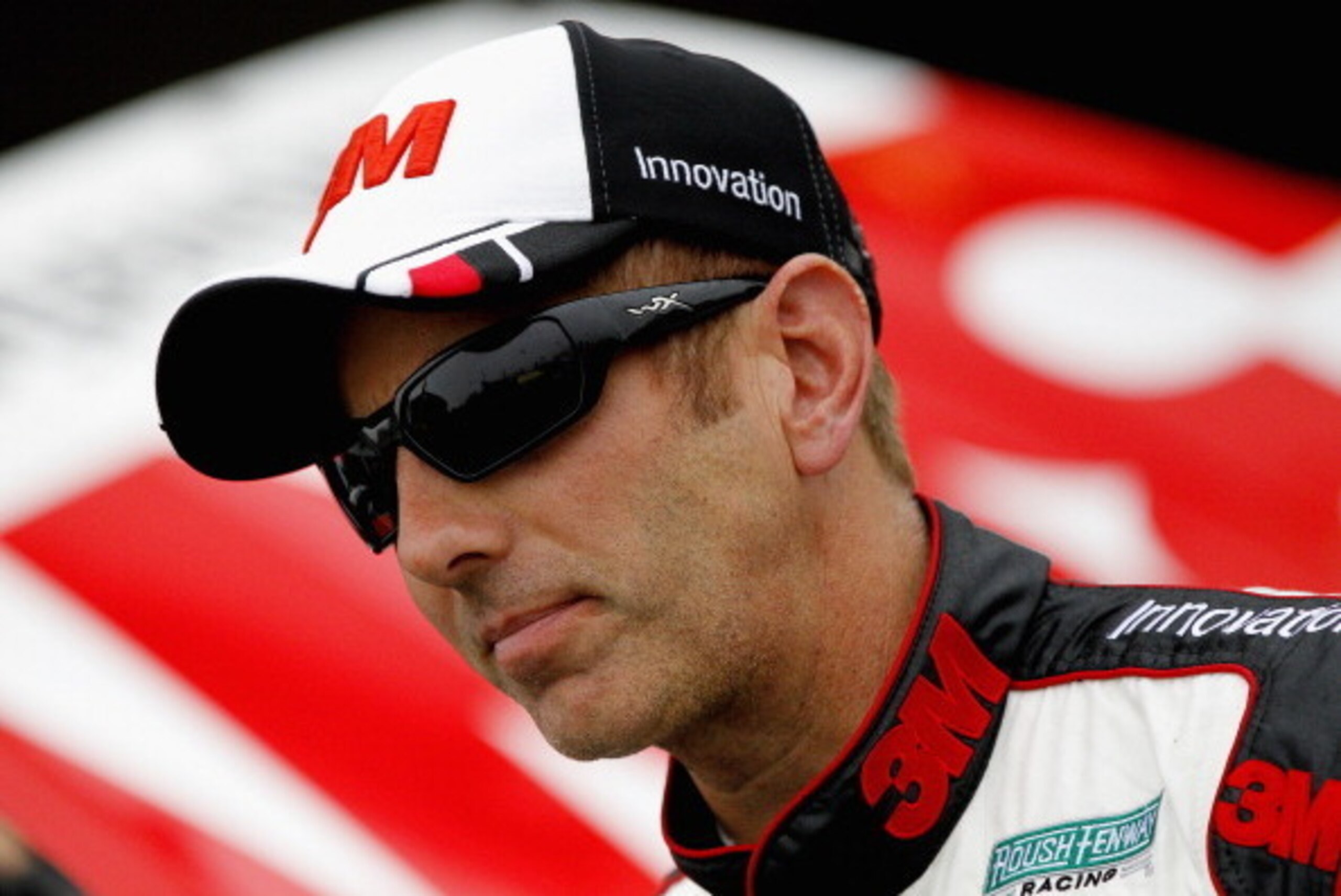 DAYTONA BEACH, FL - FEBRUARY 22:  Greg Biffle, driver of the #16 3M Ford, stands in the garage area during practice for the NASCAR Sprint Cup Series Daytona 500 at Daytona International Speedway on February 22, 2014 in Daytona Beach, Florida.  (Photo by S