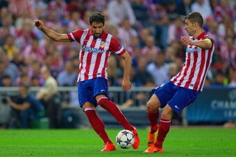 MADRID, SPAIN - APRIL 09:  Raul Garcia of Club Atletico de Madrid and Gabi of Club Atletico de Madrid on the ball  during the UEFA Champions League Quarter Final second leg match between Club Atletico de Madrid and FC Barcelona at Vicente Calderon Stadium