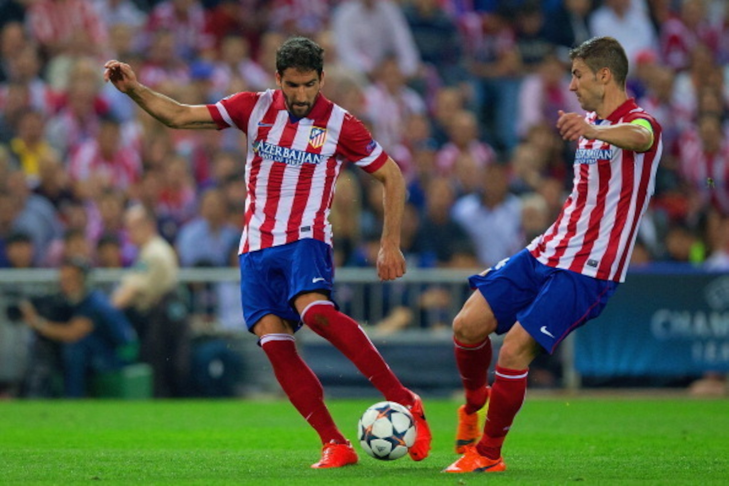 MADRID, SPAIN - APRIL 09:  Raul Garcia of Club Atletico de Madrid and Gabi of Club Atletico de Madrid on the ball  during the UEFA Champions League Quarter Final second leg match between Club Atletico de Madrid and FC Barcelona at Vicente Calderon Stadium