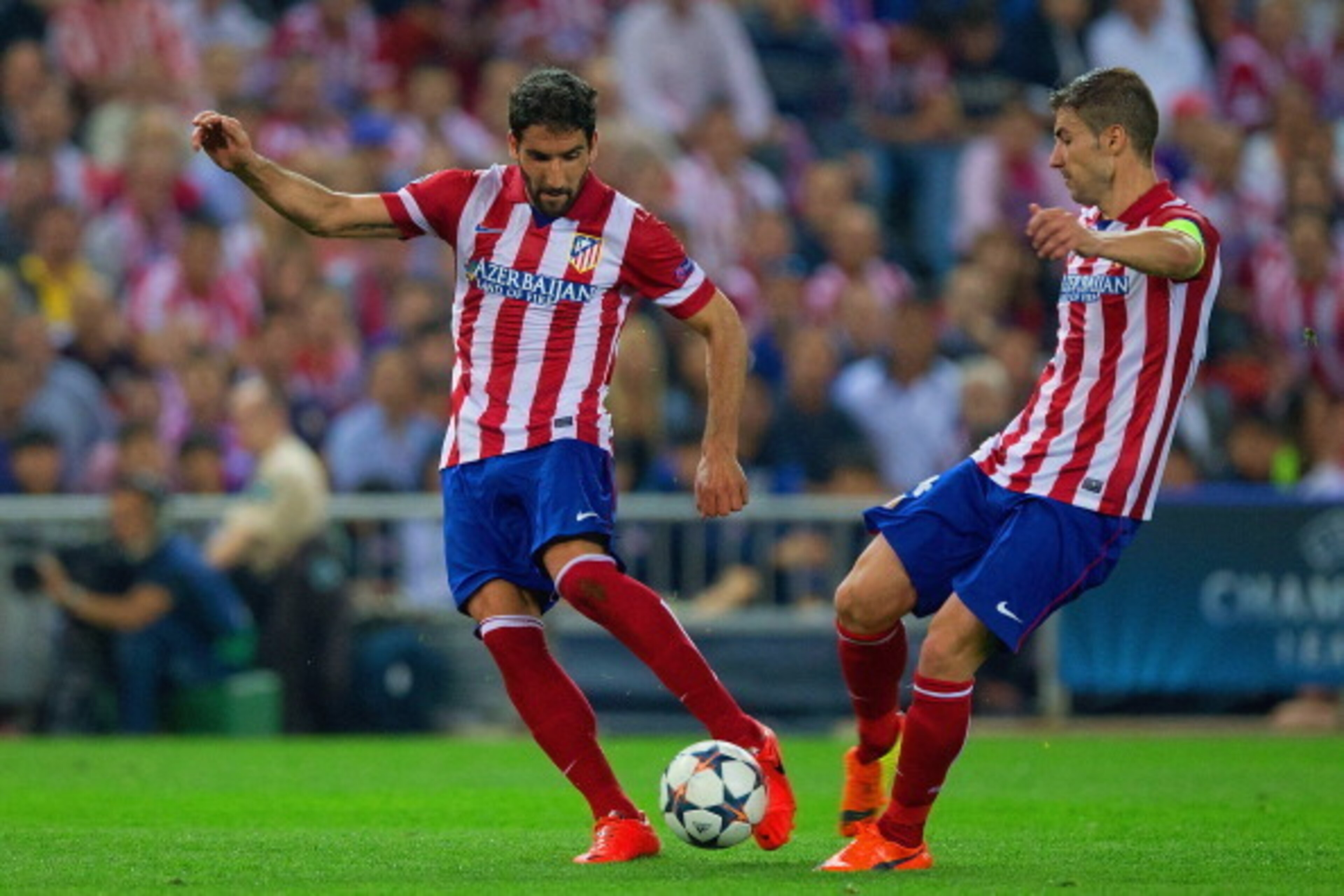 MADRID, SPAIN - APRIL 09: Raul Garcia of Club Atletico de Madrid and Gabi of Club Atletico de Madrid on the ball during the UEFA Champions League Quarter Final second leg match between Club Atletico de Madrid and FC Barcelona at Vicente Calderon Stadium MADRID, SPAIN - APRIL 09: Raul Garcia of Club Atletico de Madrid and Gabi of Club Atletico de Madrid on the ball during the UEFA Champions League Quarter Final second leg match between Club Atletico de Madrid and FC Barcelona at Vicente Calderon Stadium