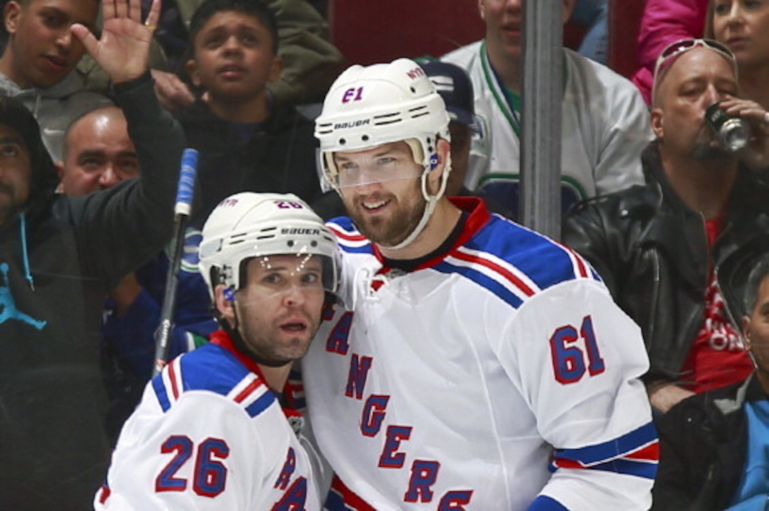 VANCOUVER, BC - APRIL 1: Rick Nash #61 congratulates Martin St. Louis #26 who scored his first goal as a member of the New York Rangers against the Vancouver Canucks during their NHL game at Rogers Arena April 1, 2014 in Vancouver, British Columbia, Canad