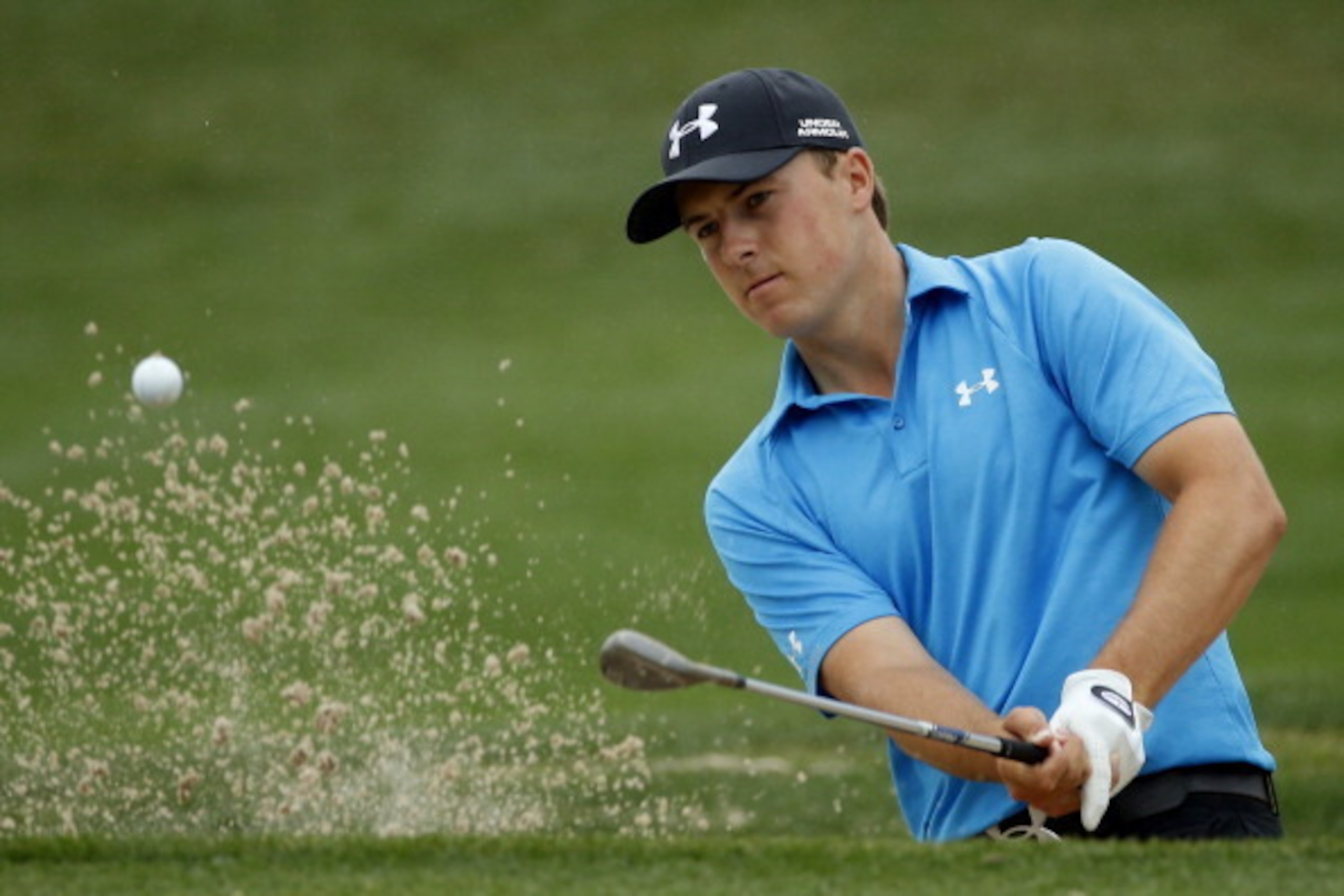 HUMBLE, TX - APRIL 03:  Jordan Spieth of the United States hits a shot out of the bunker on the eighth hole during round one of the Shell Houston Open at the Golf Club of Houston on April 3, 2014 in Humble, Texas.  (Photo by Scott Halleran/Getty Images)