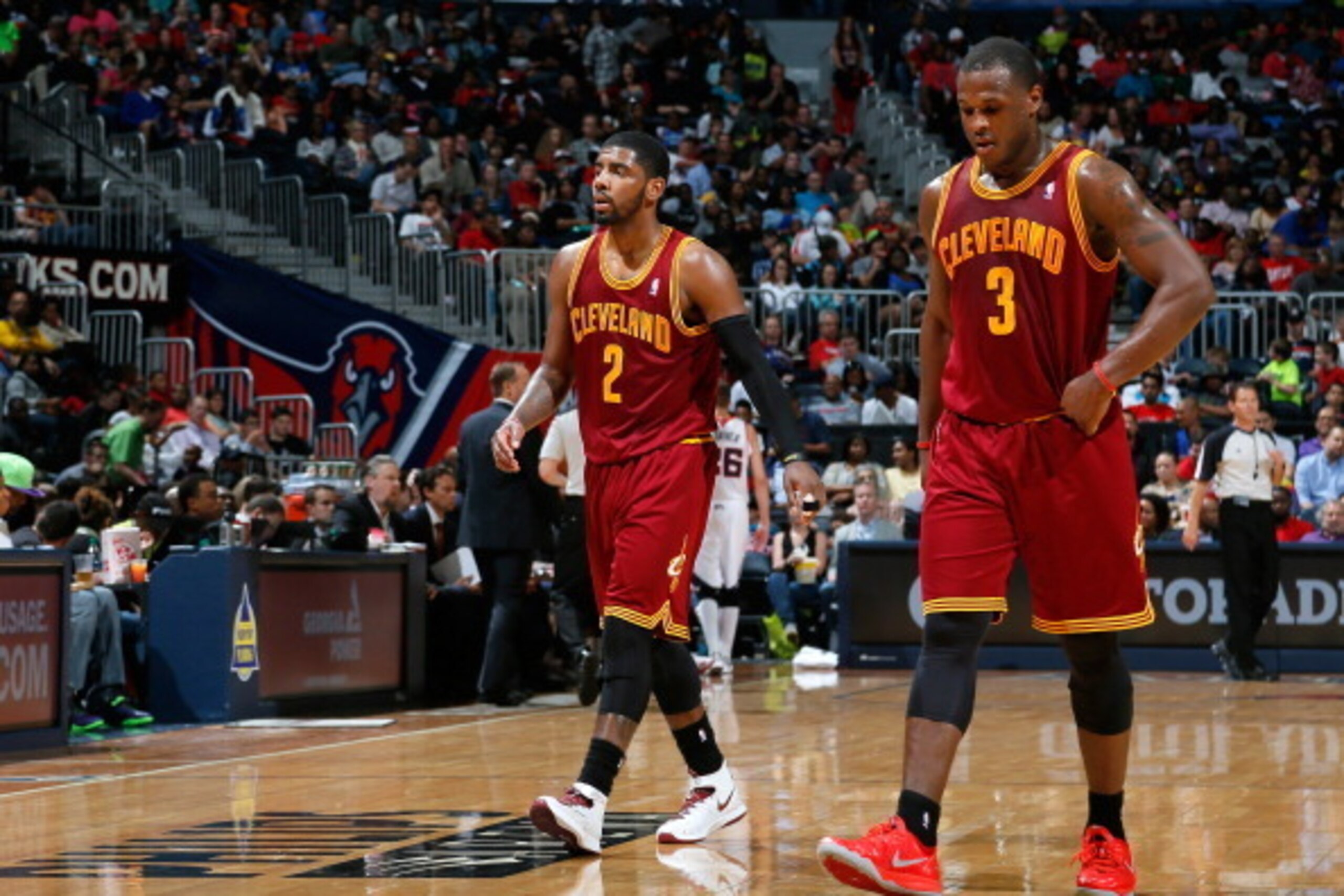 ATLANTA, GA - APRIL 04:  Kyrie Irving #2 and Dion Waiters #3 of the Cleveland Cavaliers walk off the court between free throws in their 117-98 loss to the Atlanta Hawks at Philips Arena on April 4, 2014 in Atlanta, Georgia.  NOTE TO USER: User expressly a