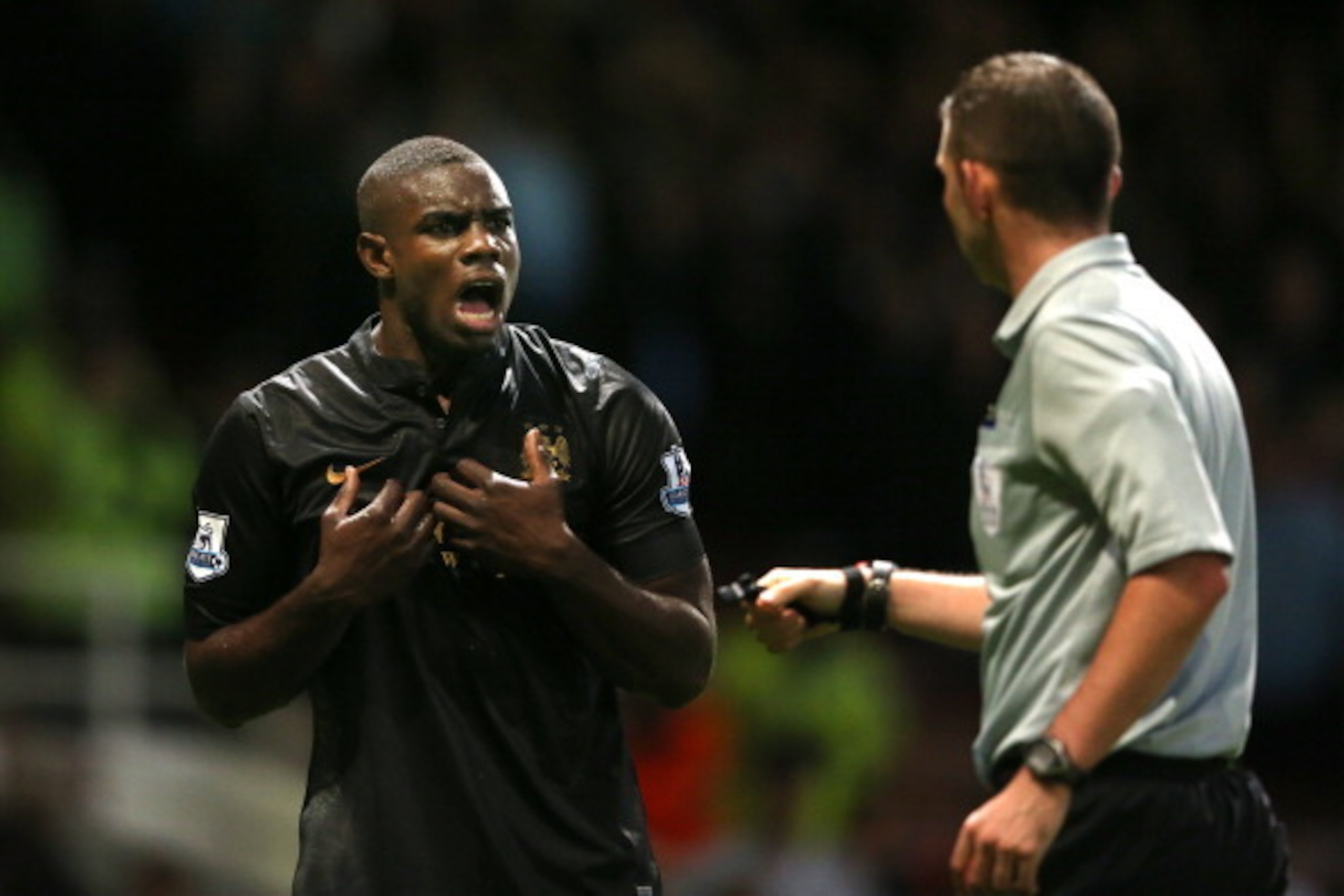 LONDON, ENGLAND - OCTOBER 19:  Micah Richards of Manchester City remonstrates with Referee Michael Oliver during the Barclays Premier League match between West Ham United and Manchester City at Boleyn Ground on October 19, 2013 in London, England.  (Photo