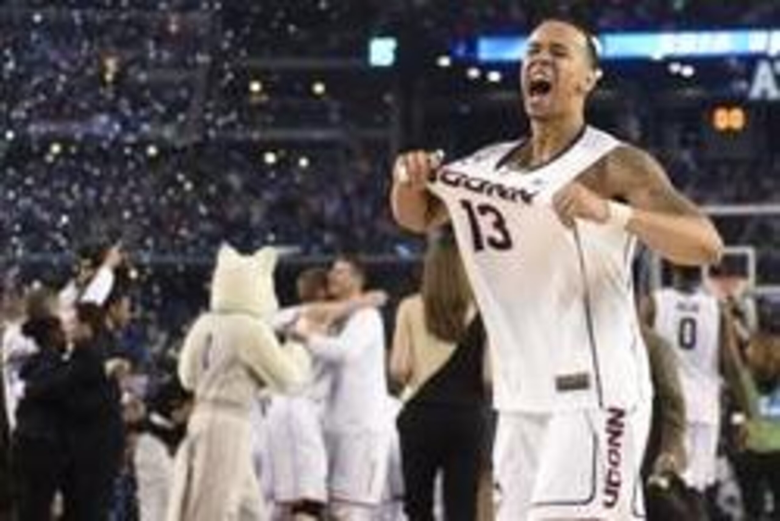 Apr 7, 2014; Arlington, TX, USA; Connecticut Huskies guard Shabazz Napier (13) celebrate after defeating the Kentucky Wildcats 60-54 in the championship game of the Final Four in the 2014 NCAA Mens Division I Championship tournament at AT&T Stadium. Manda