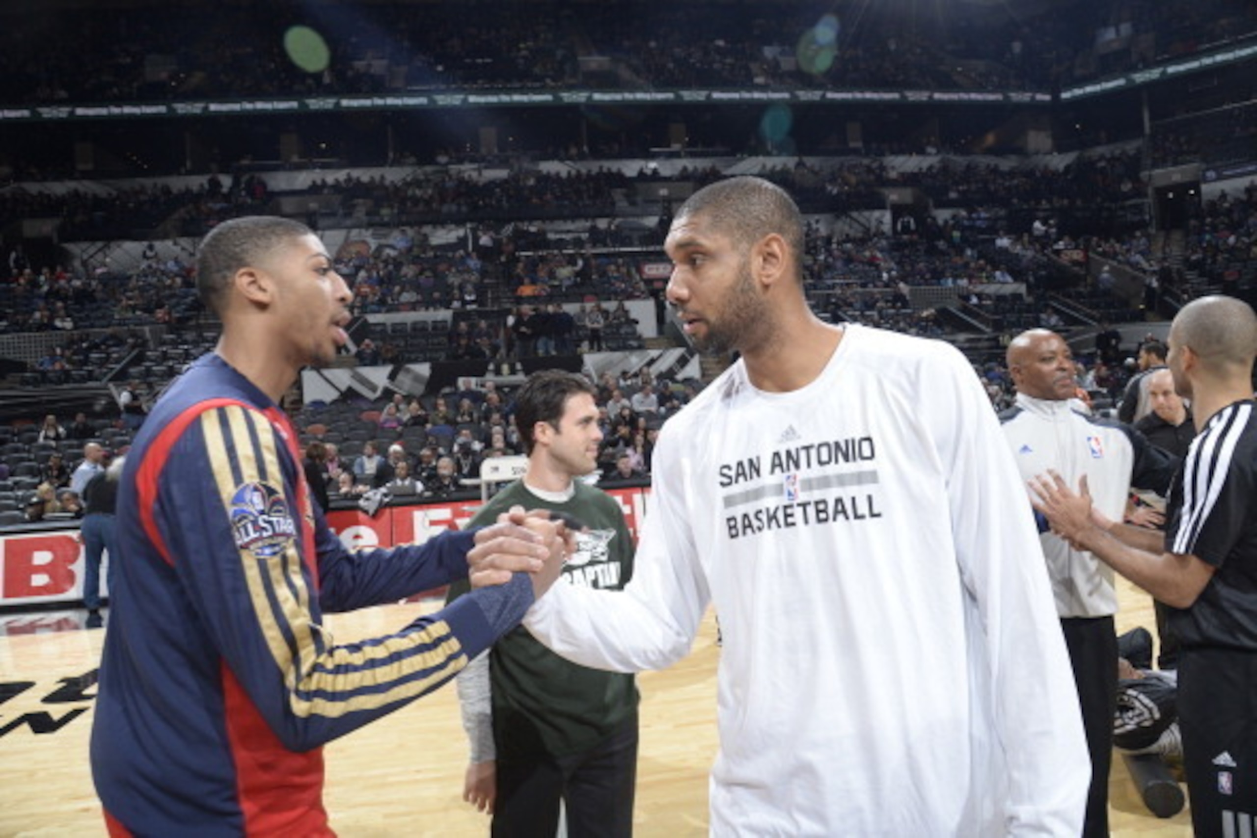 SAN ANTONIO, TX - November 25: Tim Duncan #21 of the San Antonio Spurs greets Anthony Davis #23 of the New Orleans Pelicans during the game at the AT&T Center on November 25, 2013 in San Antonio, Texas. NOTE TO USER: User expressly acknowledges and agrees