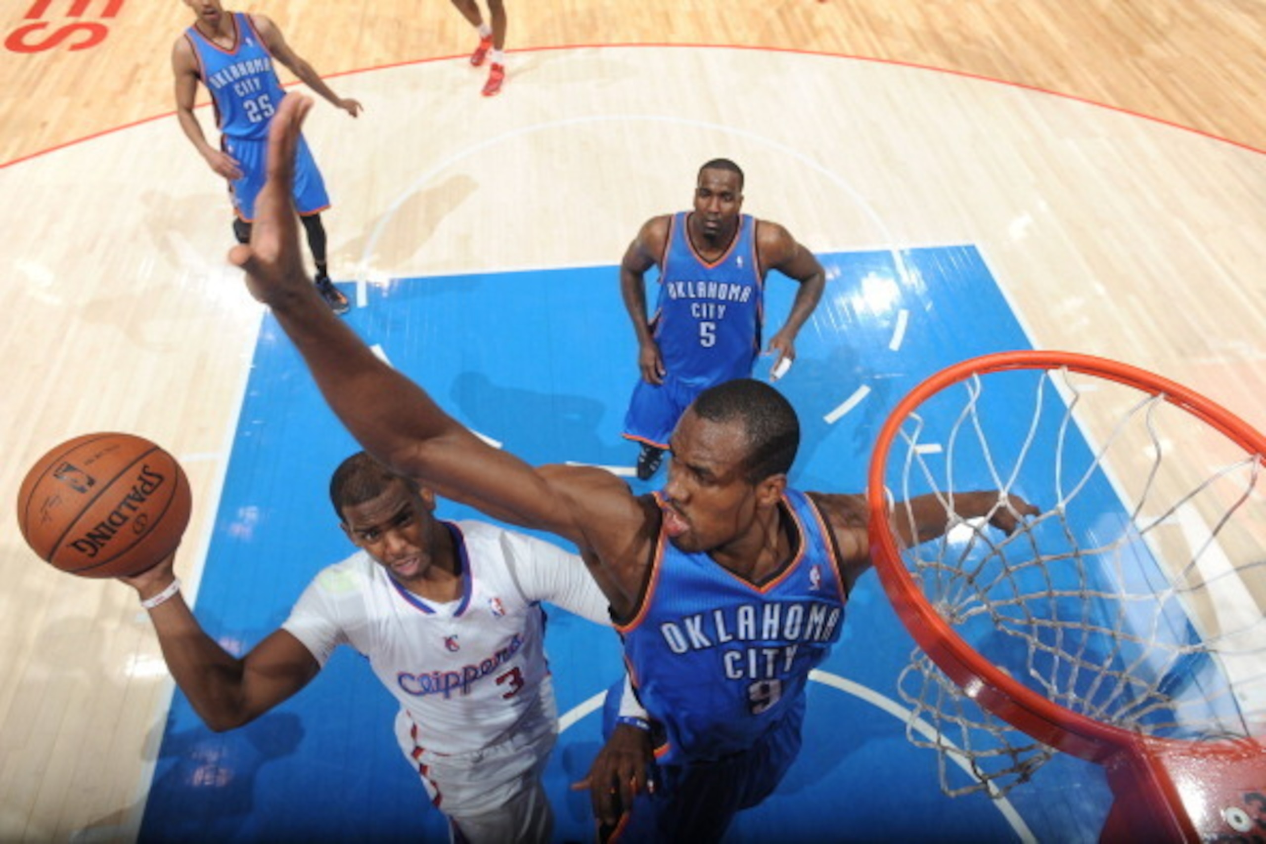 LOS ANGELES, CA - APRIL 9: Chris Paul #3 of the Los Angeles Clippers goes up for a shot against the Oklahoma City Thunder at Staples Center on April 9, 2014 in Los Angeles, California. NOTE TO USER: User expressly acknowledges and agrees that, by download