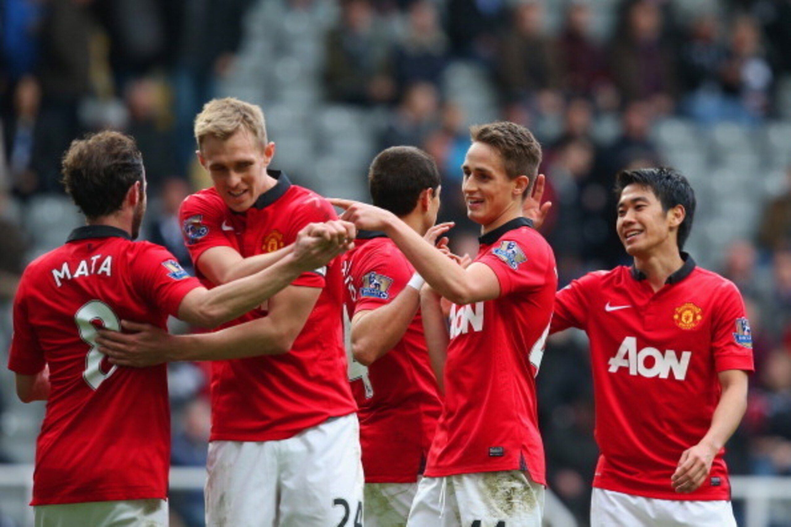 NEWCASTLE UPON TYNE, ENGLAND - APRIL 05: Juan Mata of Manchester United celebrates with team mates during the Barclays Premier League match between Newcastle United and Manchester United  at St James' Park on April 5, 2014 in Newcastle upon Tyne, England.