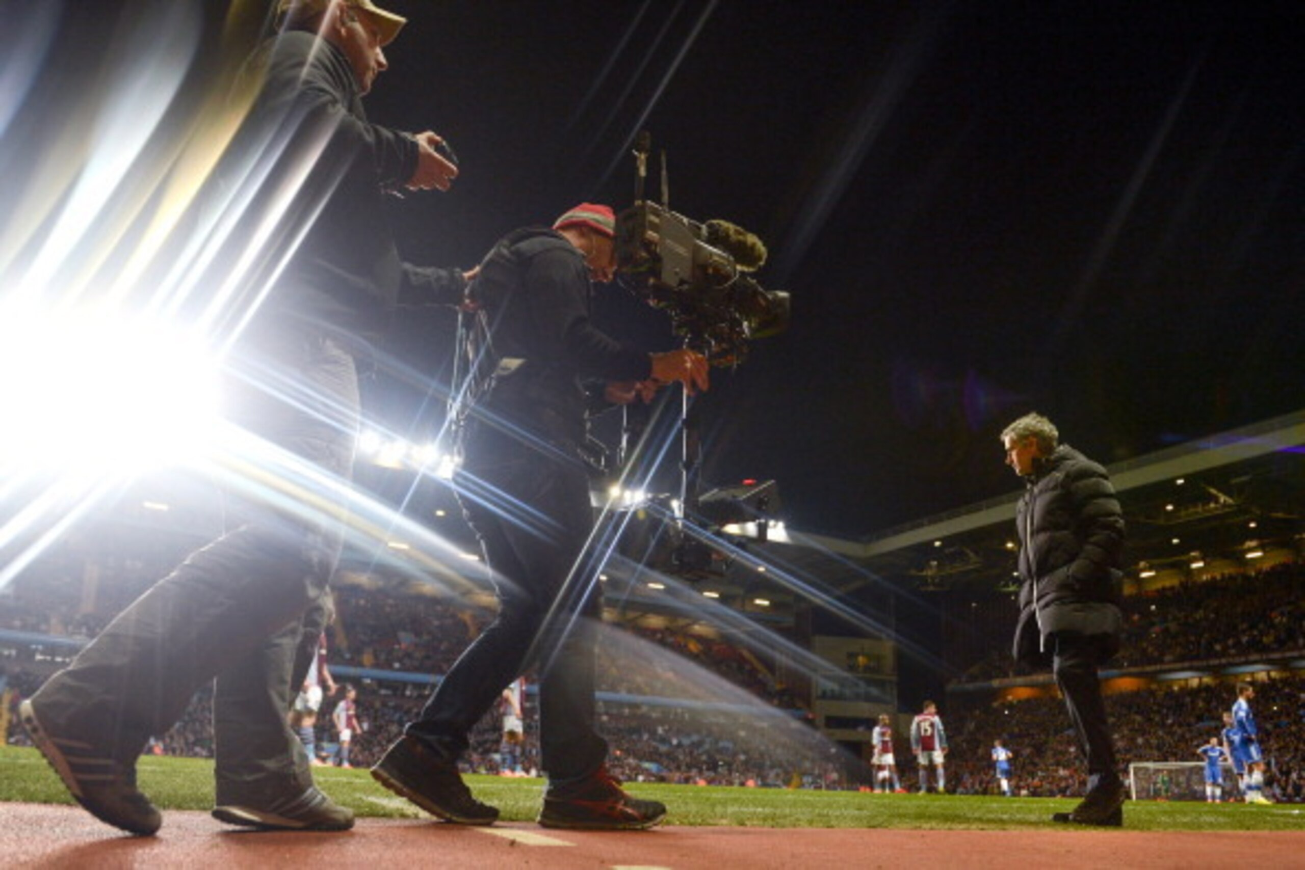 BIRMINGHAM, ENGLAND - MARCH 15:  (EDITORS NOTE: A special effects camera filter was used for this image.)  Jose Mourinho manager of Chelsea is filmed by a TV camera as he looks on during the Barclays Premier League match between Aston Villa and Chelsea at