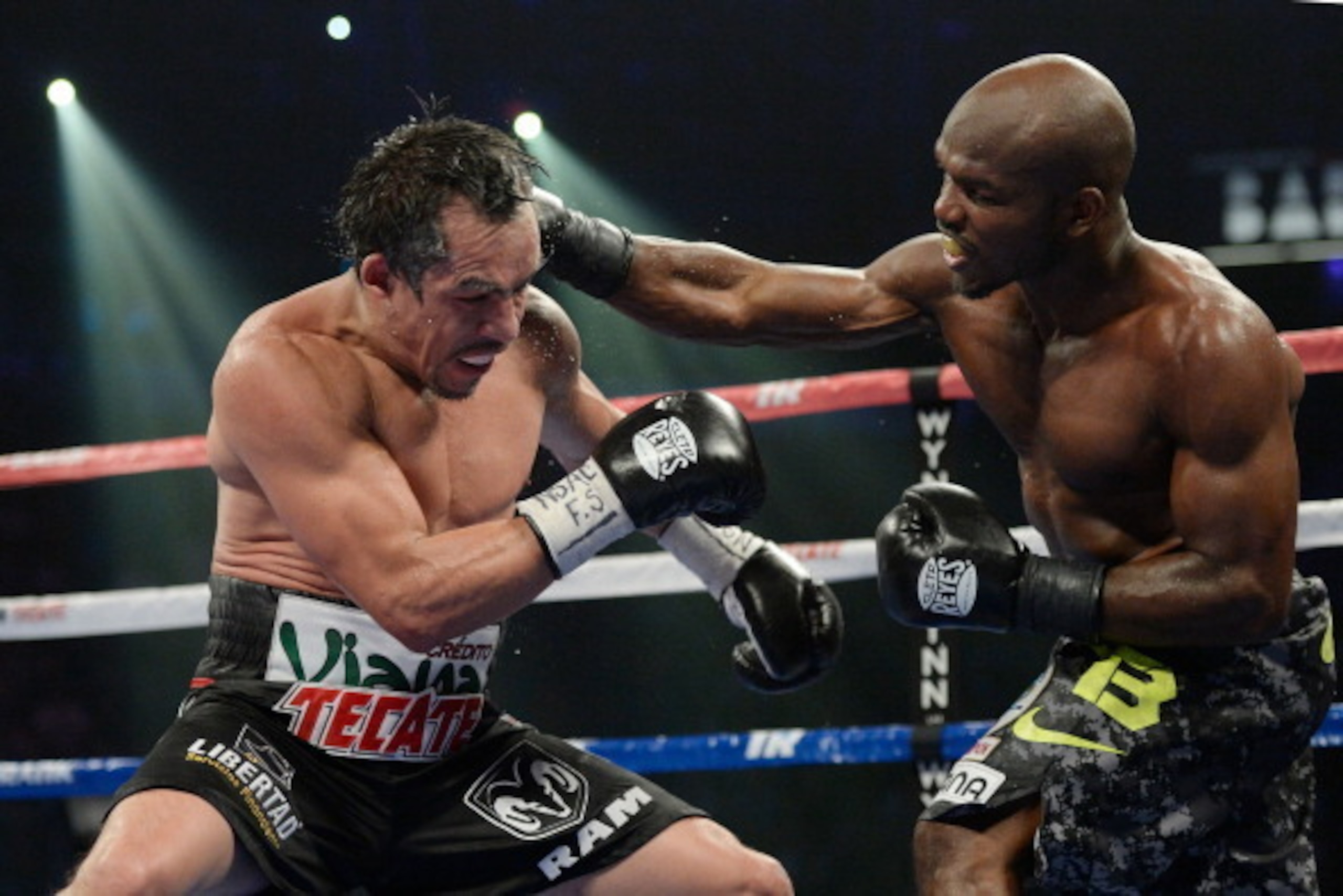 LAS VEGAS, NV - OCTOBER 12:  WBO welterweight champion Timothy Bradley Jr. (R) lands a punch to the head of Juan Manuel Marquez during their bout at the Thomas & Mack Center on October 12, 2013 in Las Vegas, Nevada.  Bradley won in a split-decision. (Phot