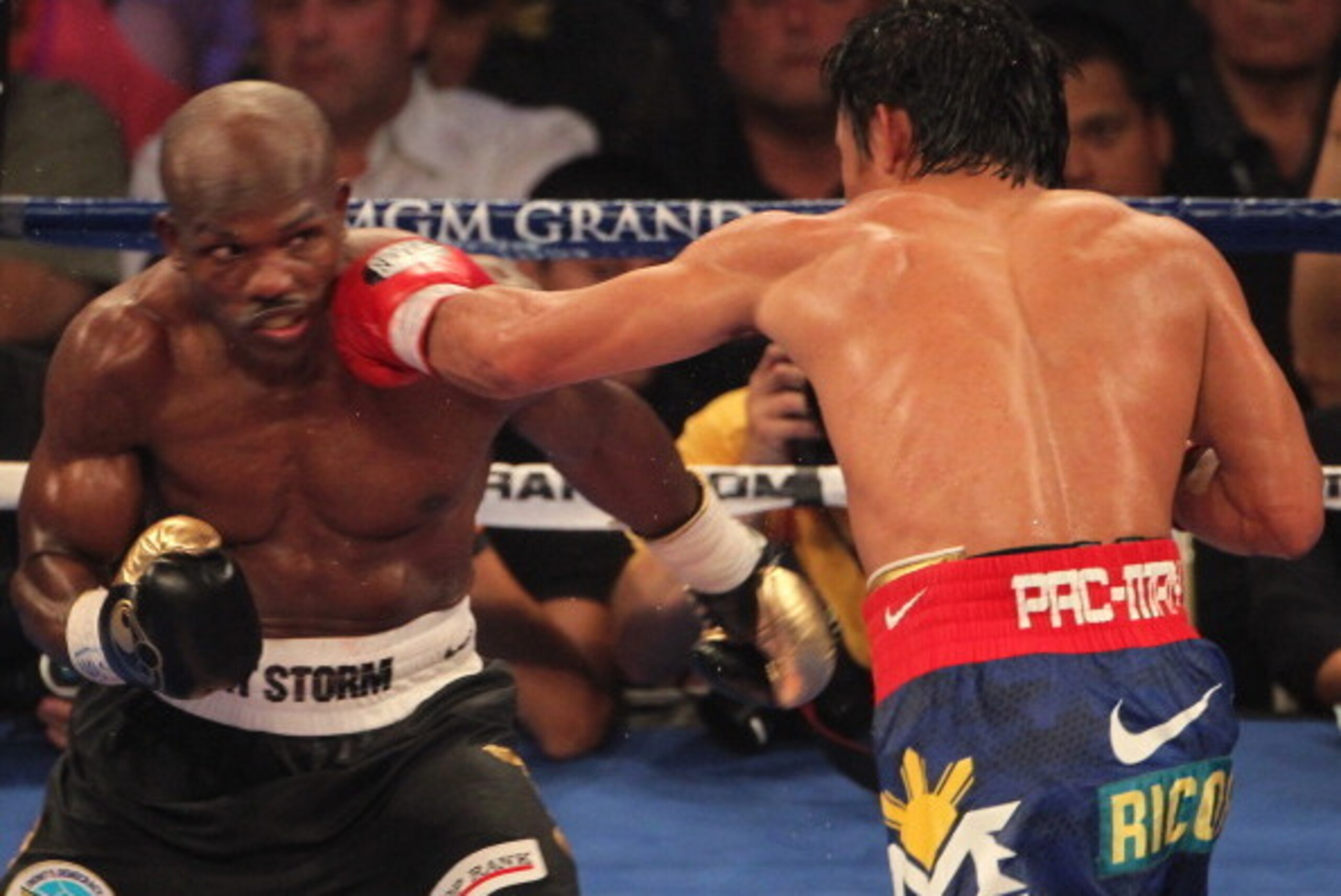 LAS VEGAS, NV - JUNE 09:  (R-L) Manny Pacquiao lands a left to the head of Timothy Bradley during their WBO welterweight title fight at MGM Grand Garden Arena on June 9, 2012 in Las Vegas, Nevada.  (Photo by Jeff Bottari/Getty Images)