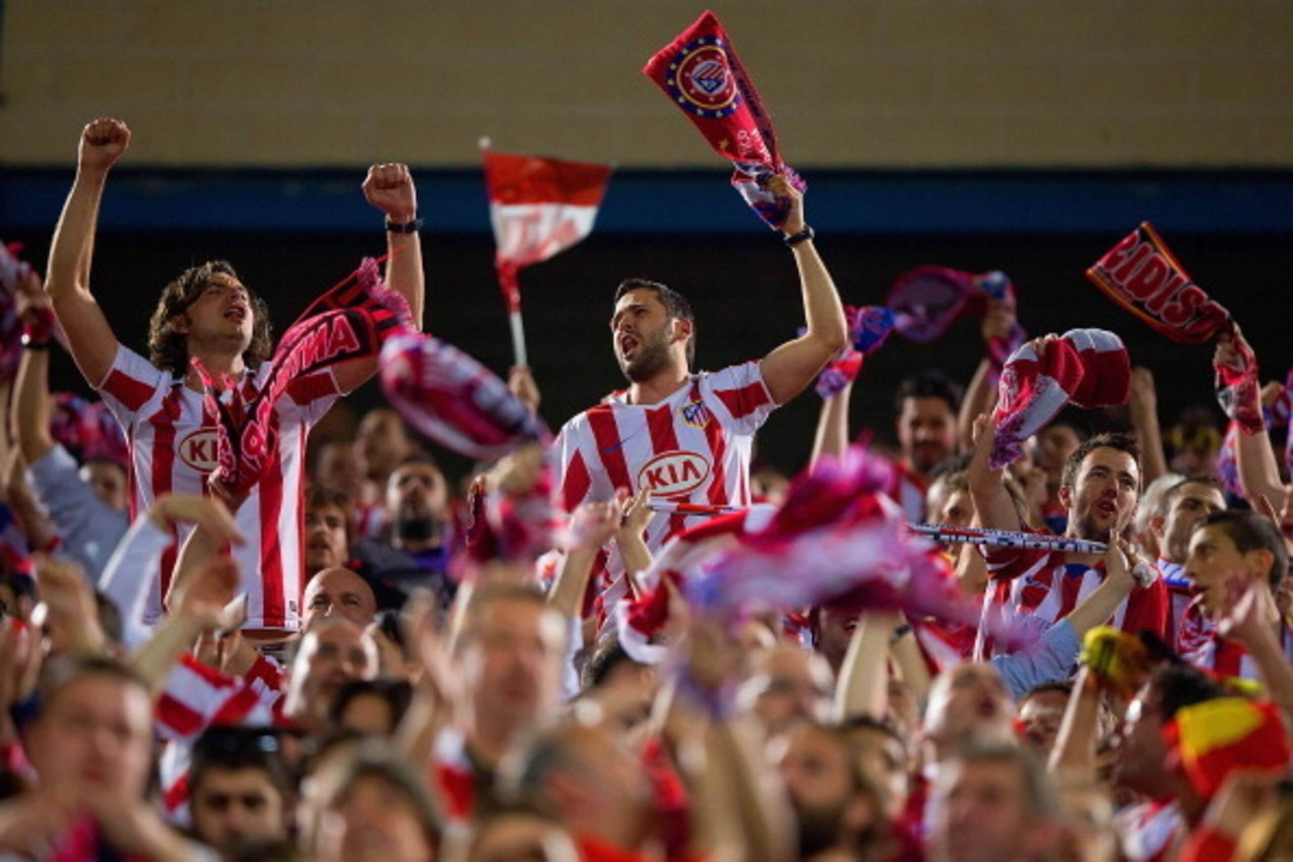 MADRID, SPAIN - APRIL 09:  Atletico de Madrid fans celebrate during the UEFA Champions League Quarter Final second leg match between Club Atletico de Madrid and FC Barcelona at Vicente Calderon Stadium on April 9, 2014 in Madrid, Spain.  (Photo by Gonzalo
