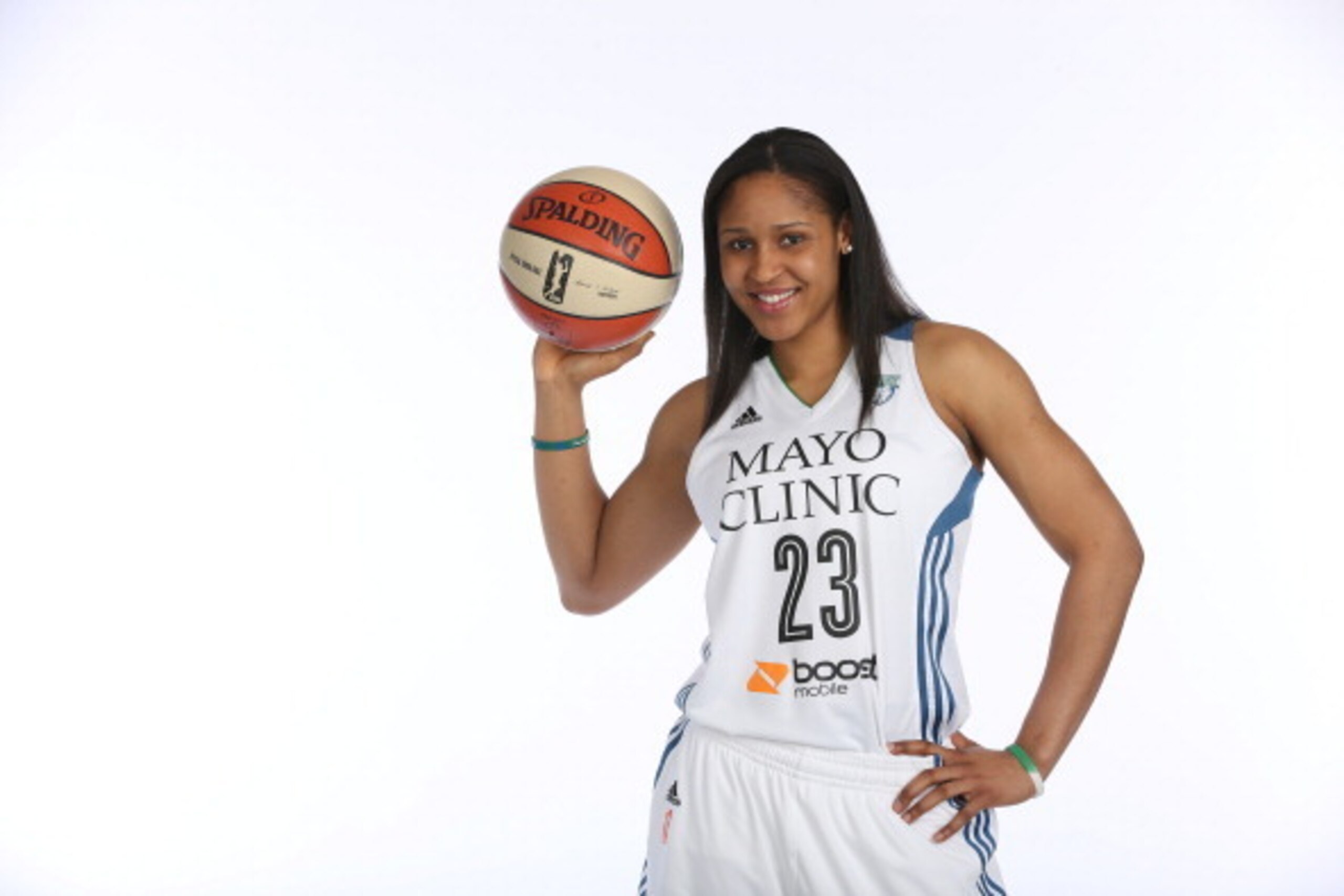 MINNEAPOLIS, MN - MARCH 17:  Maya Moore of the Minnesota Lynx poses for portraits wearing the new home uniform which displays the logo of the marquee jersey partner, the Mayo Clinic, on March 17, 2014 at Target Center in Minneapolis, Minnesota.  NOTE TO U