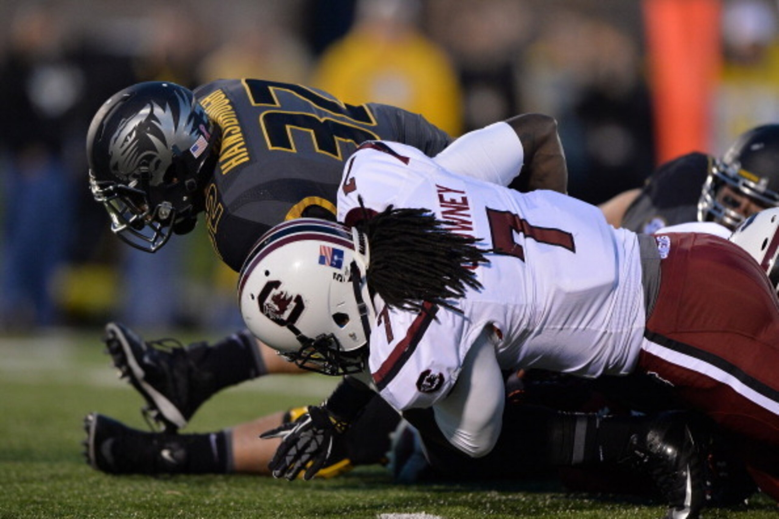 COLUMBIA, MO - OCTOBER 26:  Defensive end Jadeveon Clowney #7 of the South Carolina Gamecocks tackles running back Russell Hansbrough #32 of the Missouri Tigers during the first half on October 26, 2013 at Faurot Field/Memorial Stadium in Columbia, Missou