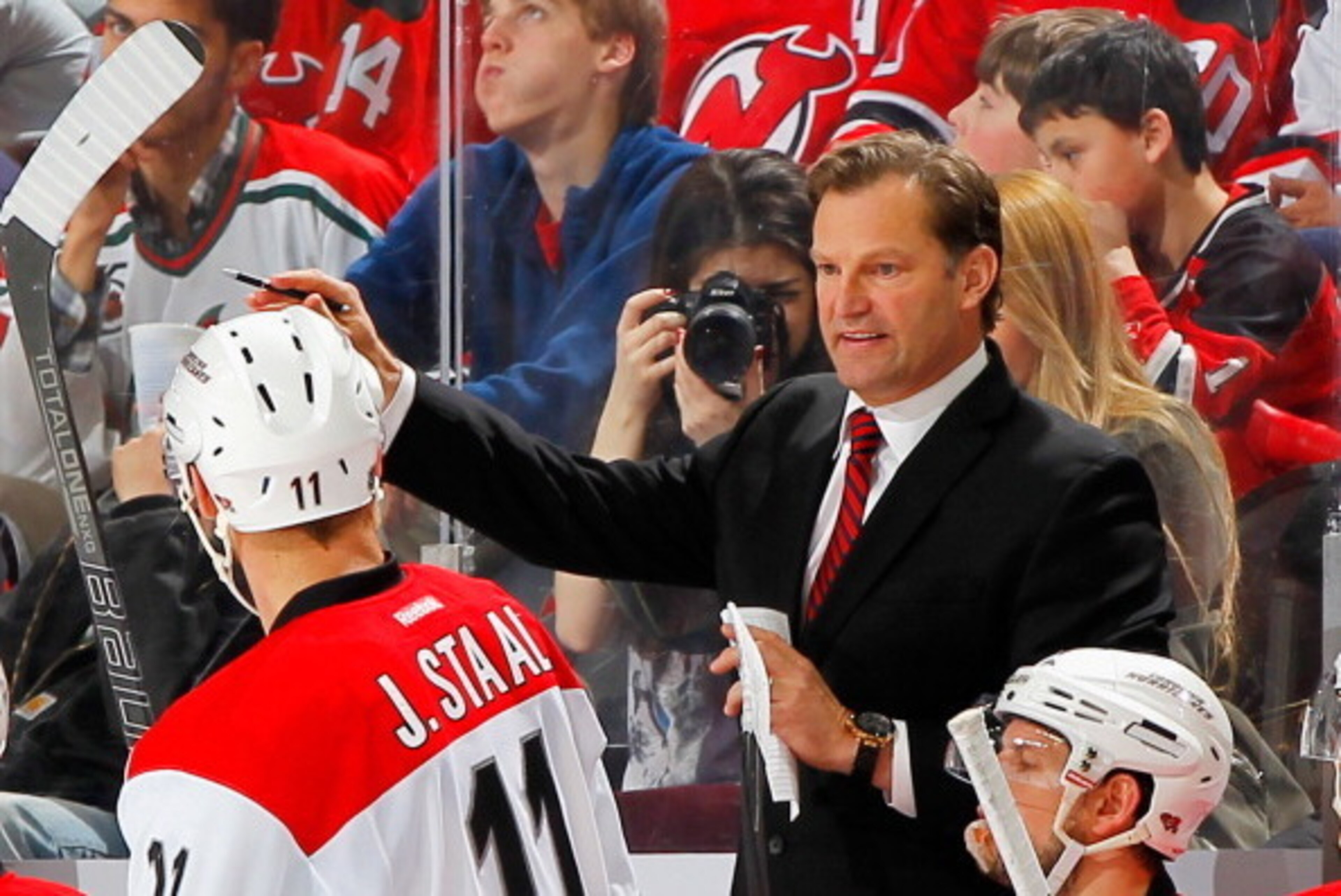 NEWARK, NJ - MARCH 08: Head coach Kirk Muller of the Carolina Hurricanes gives instructions against the New Jersey Devils during the game at the Prudential Center on March 8, 2014 in Newark, New Jersey.  (Photo by Andy Marlin/NHLI via Getty Images)