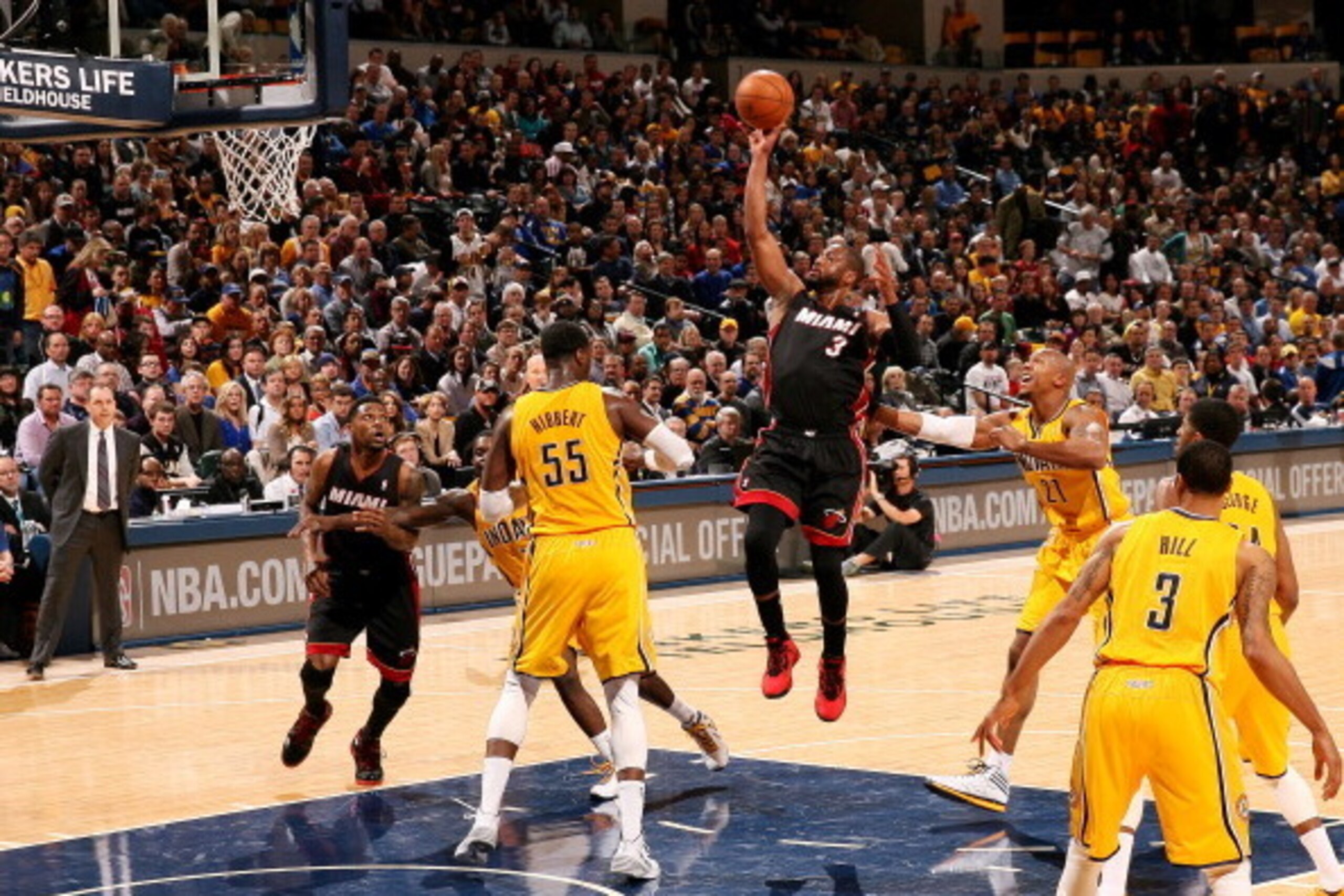INDIANAPOLIS, IN - MARCH 26: Dwyane Wade #3 of the Miami Heat shoots against Roy Hibbert #55 of the Indiana Pacers during a game on March 26, 2014 at Bankers Life Fieldhouse in Indianapolis, IN.  NOTE TO USER: User expressly acknowledges and agrees that, 