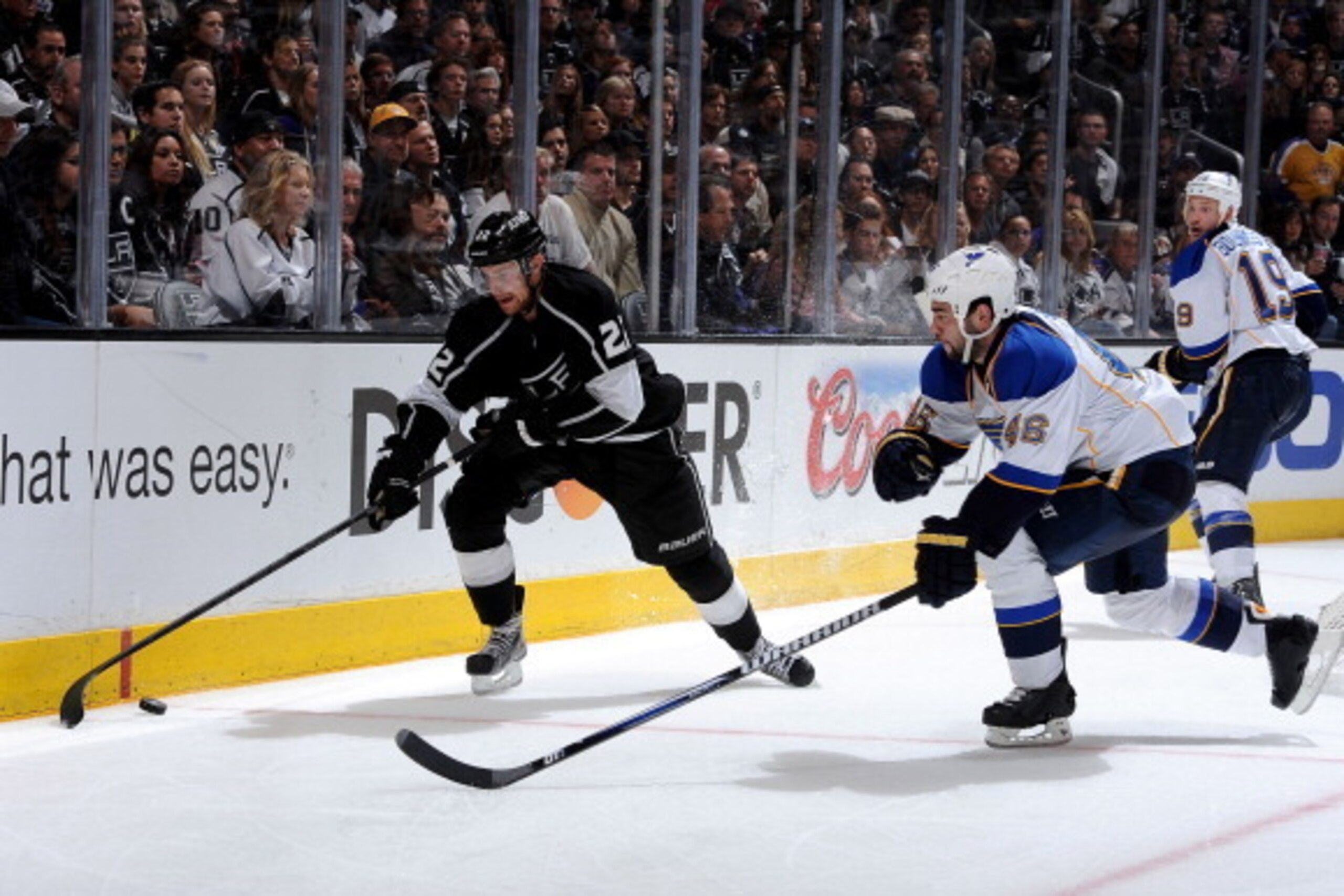 LOS ANGELES, CA - MAY 10: Trevor Lewis #22 of the Los Angeles Kings skates with the puck against Roman Polak #46 of the St. Louis Blues in Game Six of the Western Conference Quarterfinals during the 2013 NHL Stanley Cup Playoffs at Staples Center on May LOS ANGELES, CA - MAY 10: Trevor Lewis #22 of the Los Angeles Kings skates with the puck against Roman Polak #46 of the St. Louis Blues in Game Six of the Western Conference Quarterfinals during the 2013 NHL Stanley Cup Playoffs at Staples Center on May