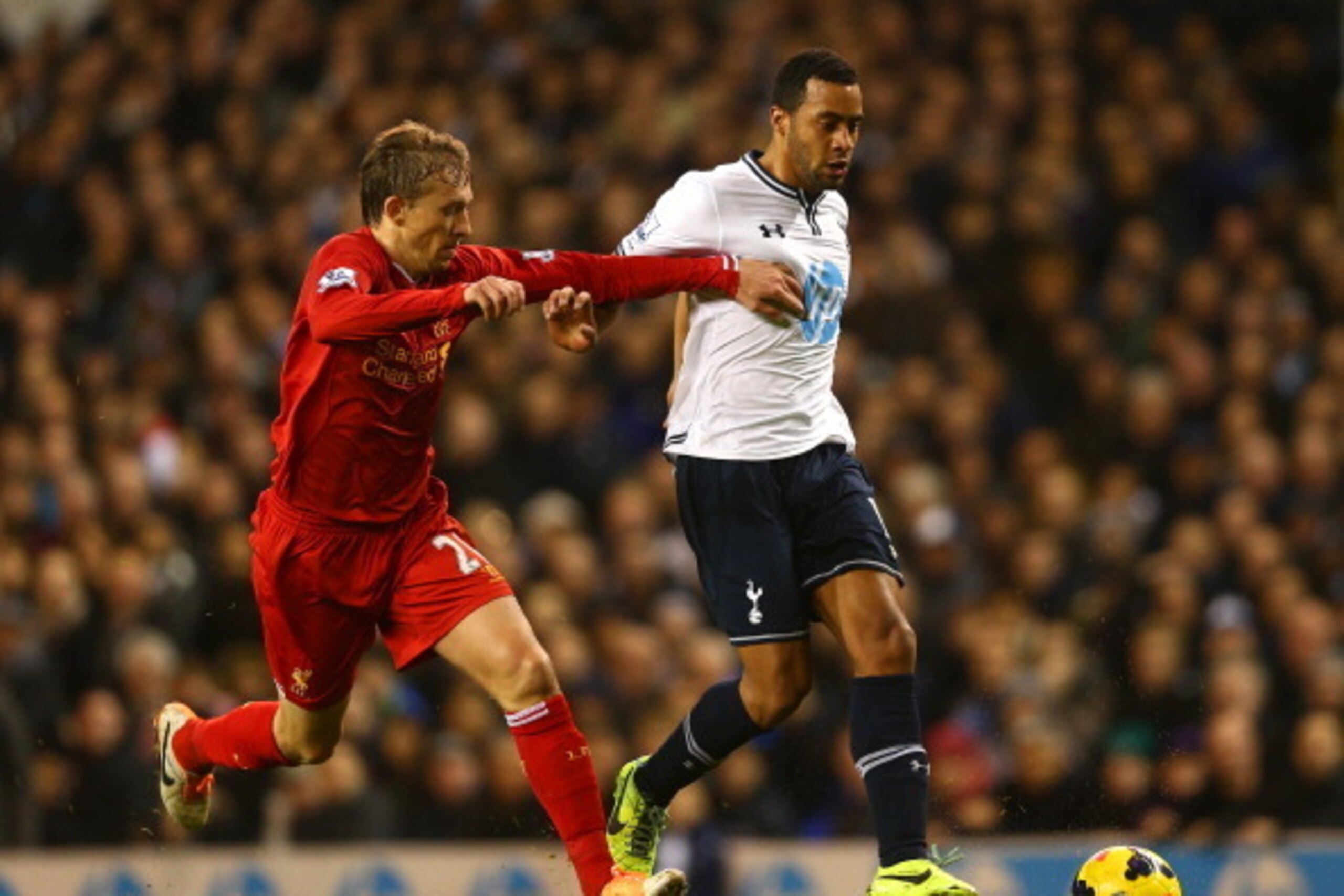 LONDON, ENGLAND - DECEMBER 15:  Lucas Leiva of Liverpool marshalls Mousa Dembele of Tottenham Hotspur during the Barclays Premier League match between Tottenham Hotspur and Liverpool at White Hart Lane on December 15, 2013 in London, England.  (Photo by P