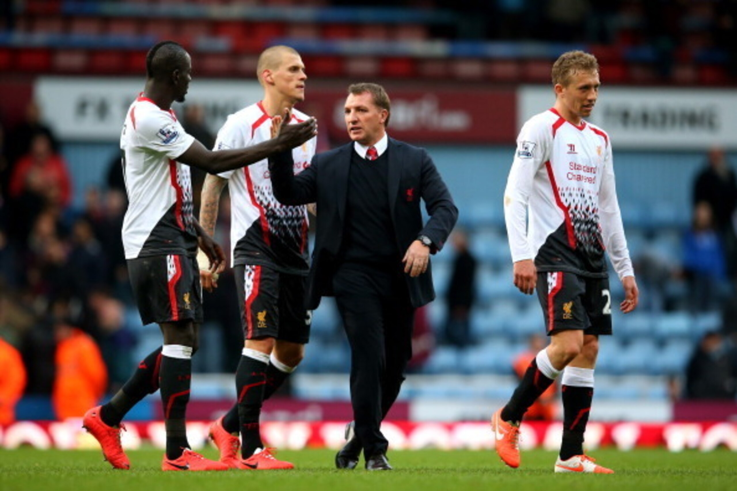 LONDON, ENGLAND - APRIL 06:  Mamadou Sakho of Liverpool and Brendan Rogers the Liverpool manager celebrate their team's 2-1 victory during the Barclays Premier League match between West Ham United and Liverpool at Boleyn Ground on April 6, 2014 in London,