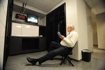 ATLANTA, GA - MARCH 08: Los Angeles Lakers head coach Phil Jackson reads in the locker room prior to a game against the Atlanta Hawks on March 8, 2011 at Philips Arena in Atlanta, Georgia.  NOTE TO USER: User expressly acknowledges and agrees that, by dow