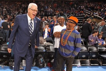 NEW YORK, NY - April 5: Phil Jackson and Spike Lee share a laugh before the game between the New York Knicks and the Milwaukee Bucks on April 5, 2013 at Madison Square Garden in New York City.  NOTE TO USER: User expressly acknowledges and agrees that, by