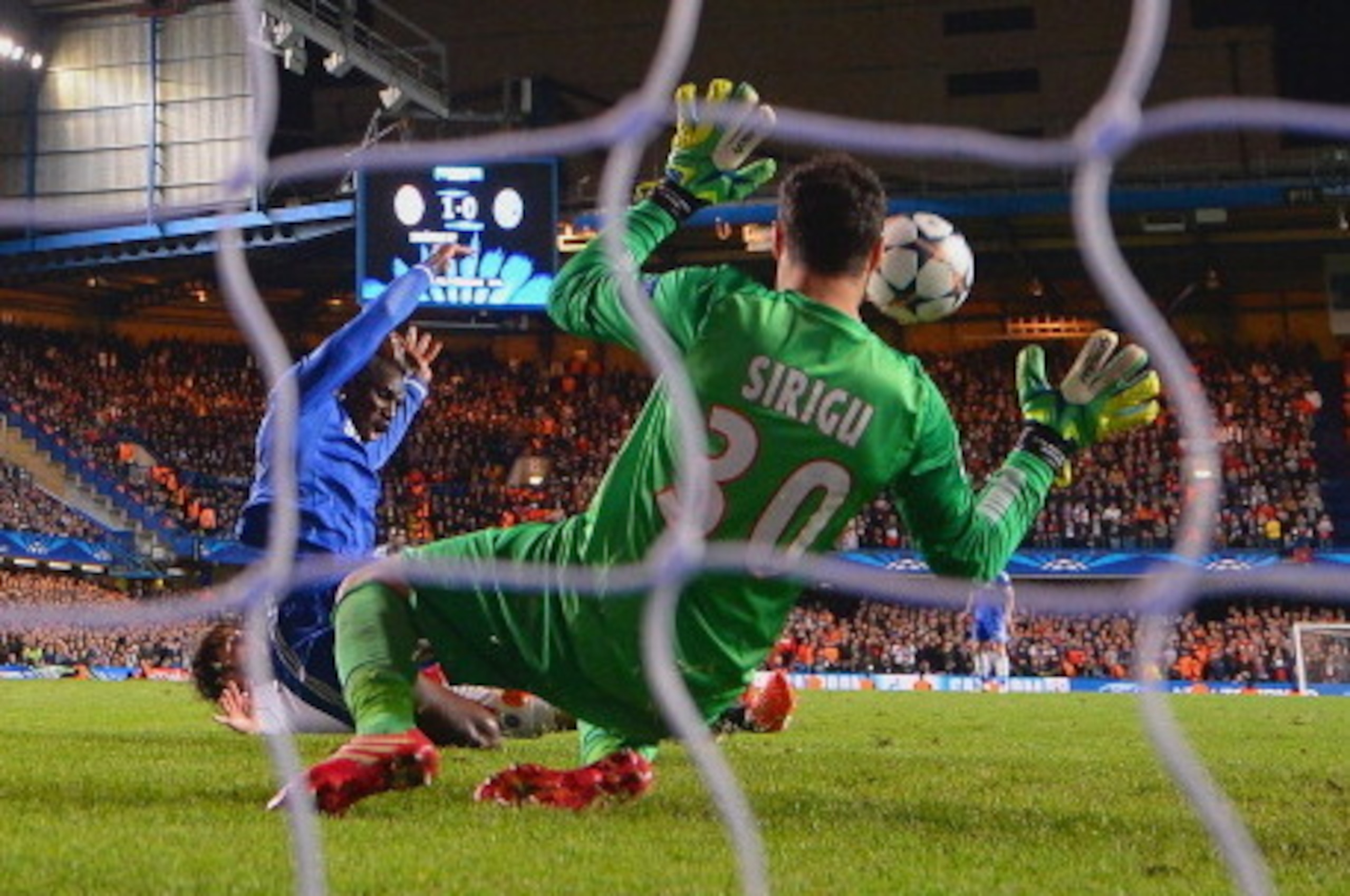 LONDON, ENGLAND - APRIL 08:  Demba Ba of Chelsea scores their second goal past Salvatore Sirigu of PSG during the UEFA Champions League Quarter Final second leg match between Chelsea and Paris Saint-Germain FC at Stamford Bridge on April 8, 2014 in London