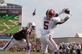 Sep 14, 2013; College Station, TX, USA; Alabama Crimson Tide cornerback Cyrus Jones (5) intercepts the ball in the end zone in the second quarter against Texas A&M Aggies receiver Ja'Quay Williams (4) at Kyle Field. Mandatory Credit: Matthew Emmons-USA TO