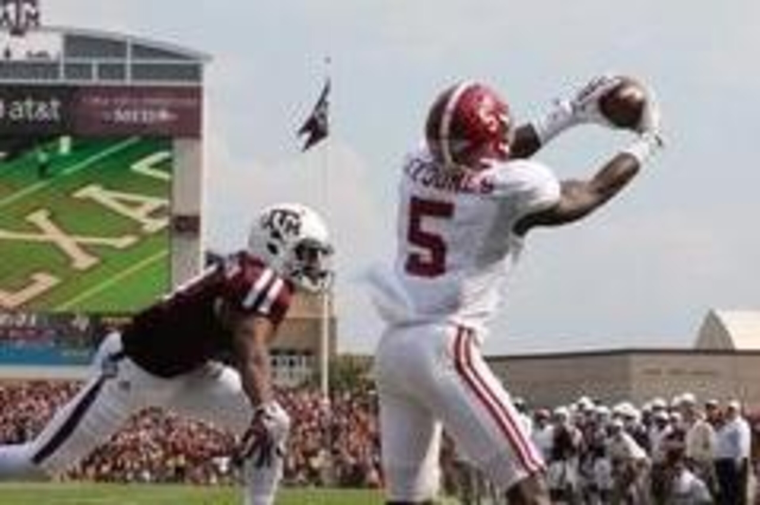 Sep 14, 2013; College Station, TX, USA; Alabama Crimson Tide cornerback Cyrus Jones (5) intercepts the ball in the end zone in the second quarter against Texas A&M Aggies receiver Ja'Quay Williams (4) at Kyle Field. Mandatory Credit: Matthew Emmons-USA TO
