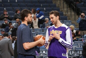 MEMPHIS, TN - FEBRUARY 26: Pau Gasol #16 of the Los Angeles Lakers talks with Marc Gasol #33 of the Memphis Grizzlies on February 26, 2014 at FedExForum in Memphis, Tennessee. NOTE TO USER: User expressly acknowledges and agrees that, by downloading and o