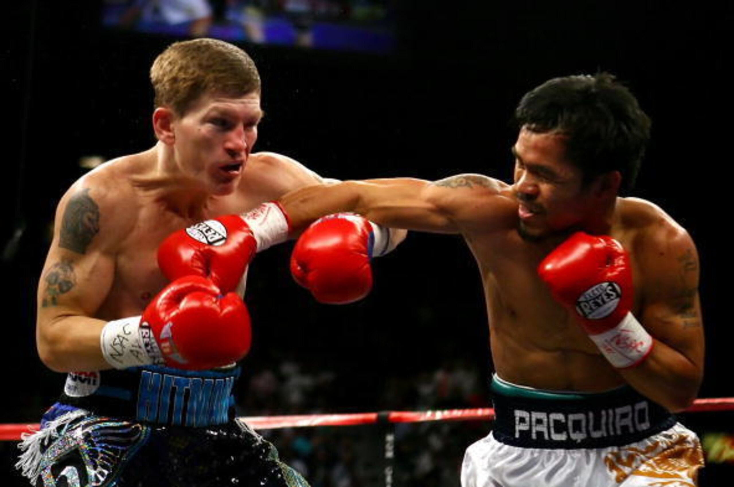 LAS VEGAS - MAY 02:  (R-L) Manny Pacquiao of the Philippines throws a right to the face of Ricky Hatton of England in the first round of their junior welterweight title fight at the MGM Grand Garden Arena May 2, 2009 in Las Vegas, Nevada. Pacquiao defeate