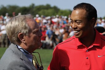 DUBLIN, OH - JUNE 03:  Tournament founder Jack Nicklaus greets Tiger Woods as he walks off the 18th green during the final round of the Memorial Tournament presented by Nationwide Insurance at Muirfield Village Golf Club on June 3, 2012 in Dublin, Ohio.