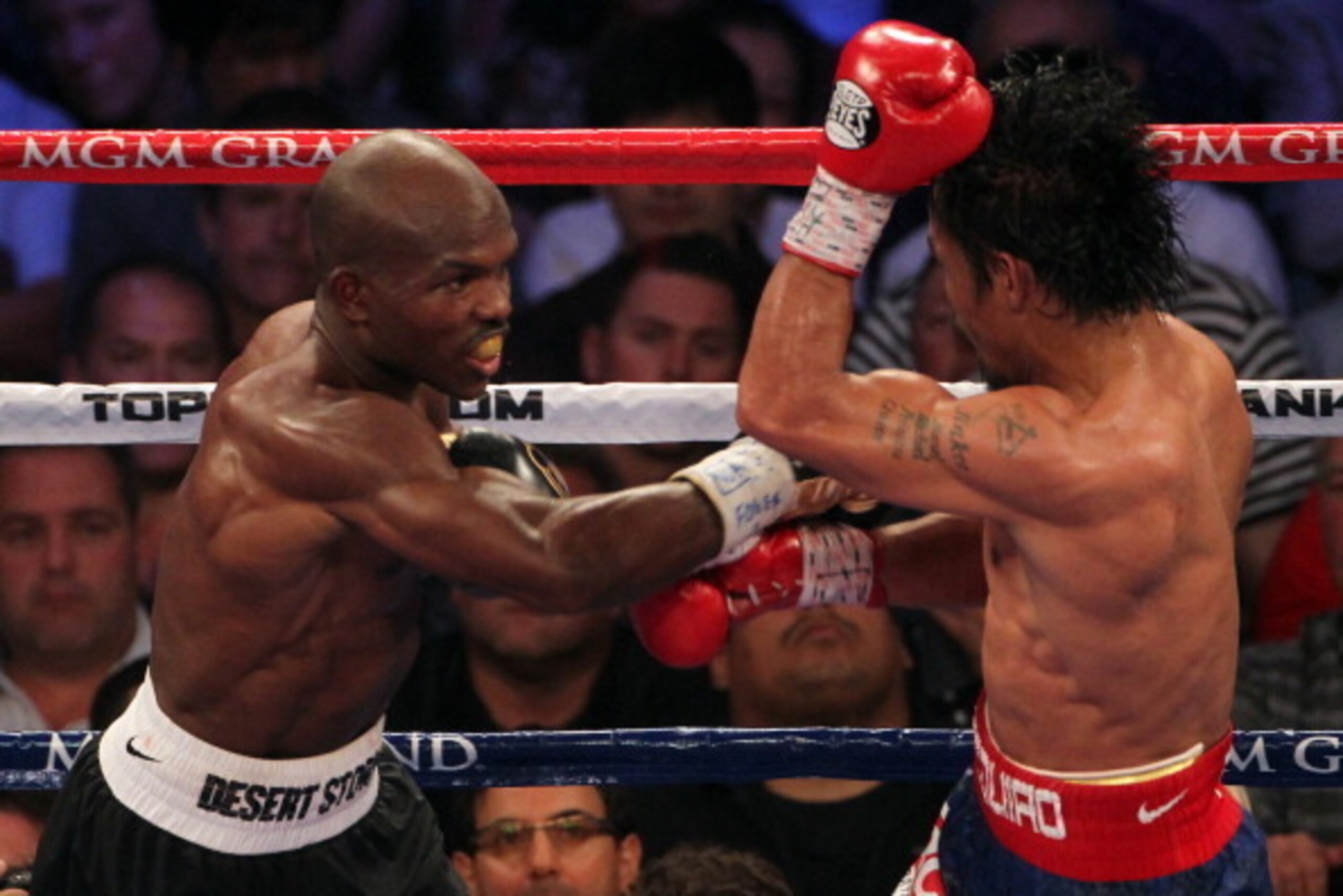 LAS VEGAS, NV - JUNE 09:  (L-R) Timothy Bradley lands a right to the head of Manny Pacquiao during their WBO welterweight title fight at MGM Grand Garden Arena on June 9, 2012 in Las Vegas, Nevada.  (Photo by Jeff Bottari/Getty Images)