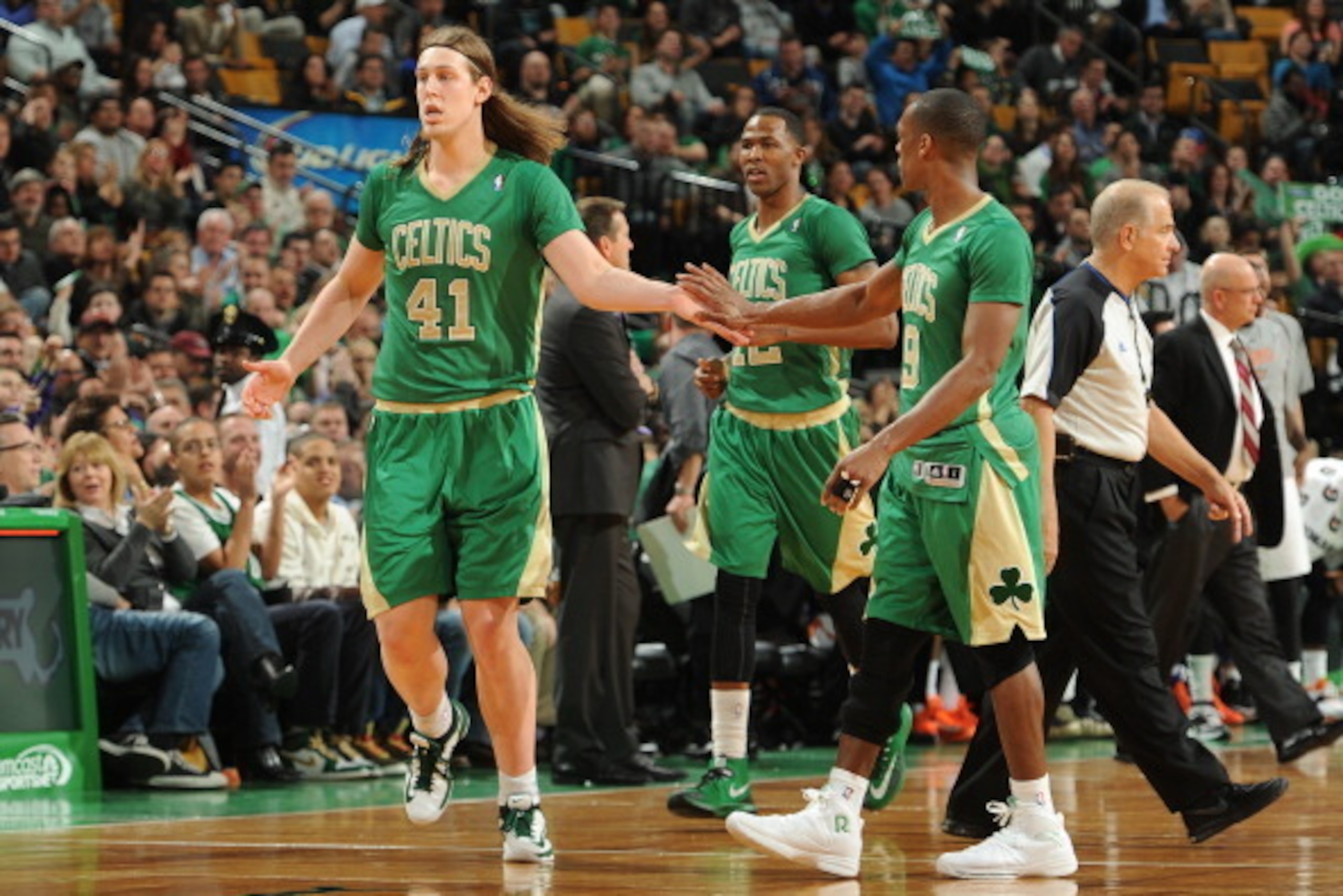 BOSTON, MA - MARCH 14: Kelly Olynyk #41 and Rajon Rondo #9 of the Boston Celtics celebrate during the game against the Phoenix Suns on March 14, 2014 at the TD Garden in Boston, Massachusetts.  NOTE TO USER: User expressly acknowledges and agrees that, by
