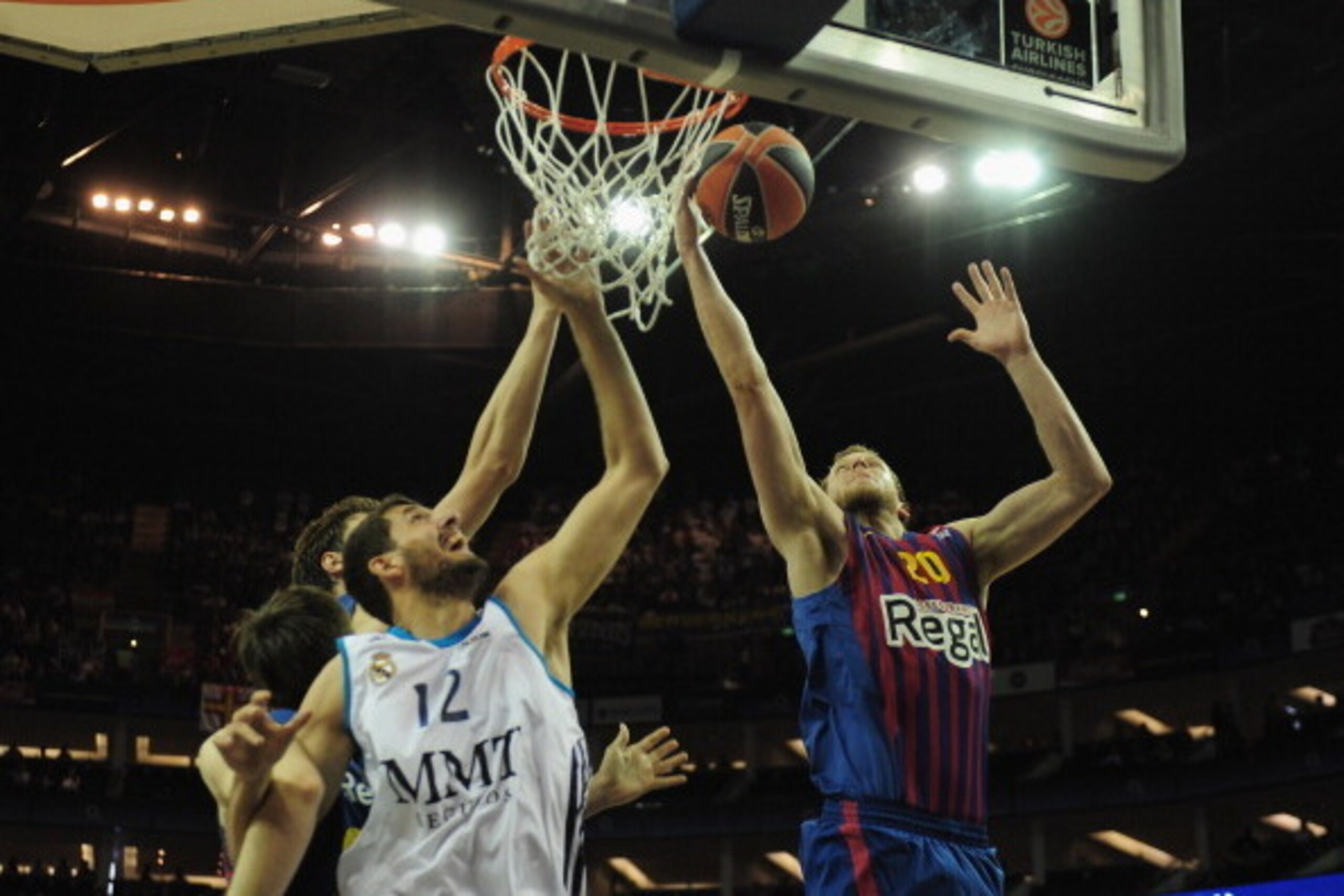 LONDON, ENGLAND - MAY 10:  Nikola Mirotic of Real Madrid tussles with Joe Ingles of FC Barcelona during the Turkish Airlines EuroLeague Final Four semi final game between FC Barcelona Regan and Real Madrid at the O2 Arena on May 10, 2013 in London, Englan