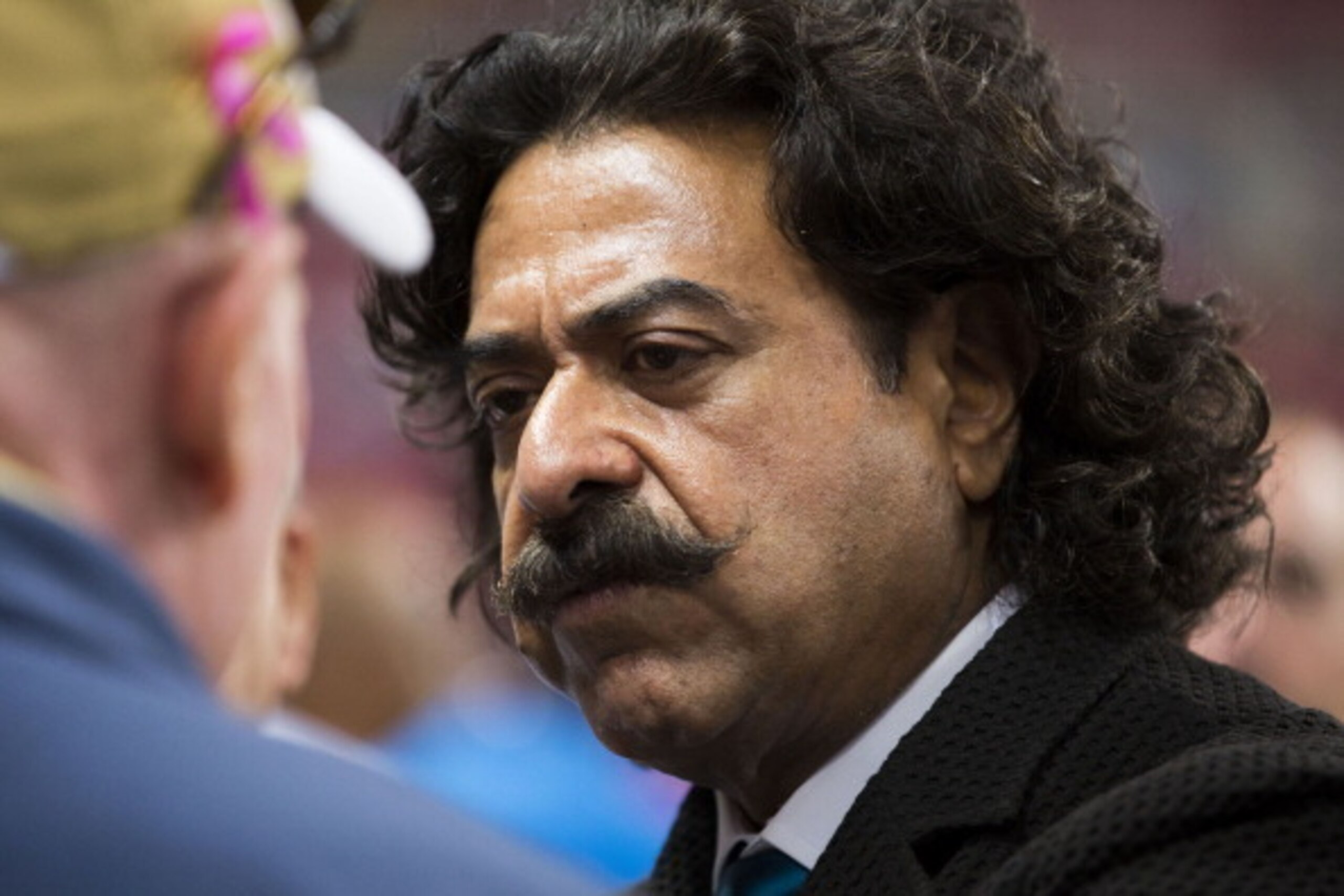 ST LOUIS, MO- OCTOBER 6: Jacksonville Jaguars and Fulham FC owner, Shahid Khan, listens intensely as he speaks with fans on the sideline prior to Sunday's football game between the Jacksonville Jaguars and the St. Louis Rams at the Edward Jones Dome on ST LOUIS, MO- OCTOBER 6: Jacksonville Jaguars and Fulham FC owner, Shahid Khan, listens intensely as he speaks with fans on the sideline prior to Sunday's football game between the Jacksonville Jaguars and the St. Louis Rams at the Edward Jones Dome on