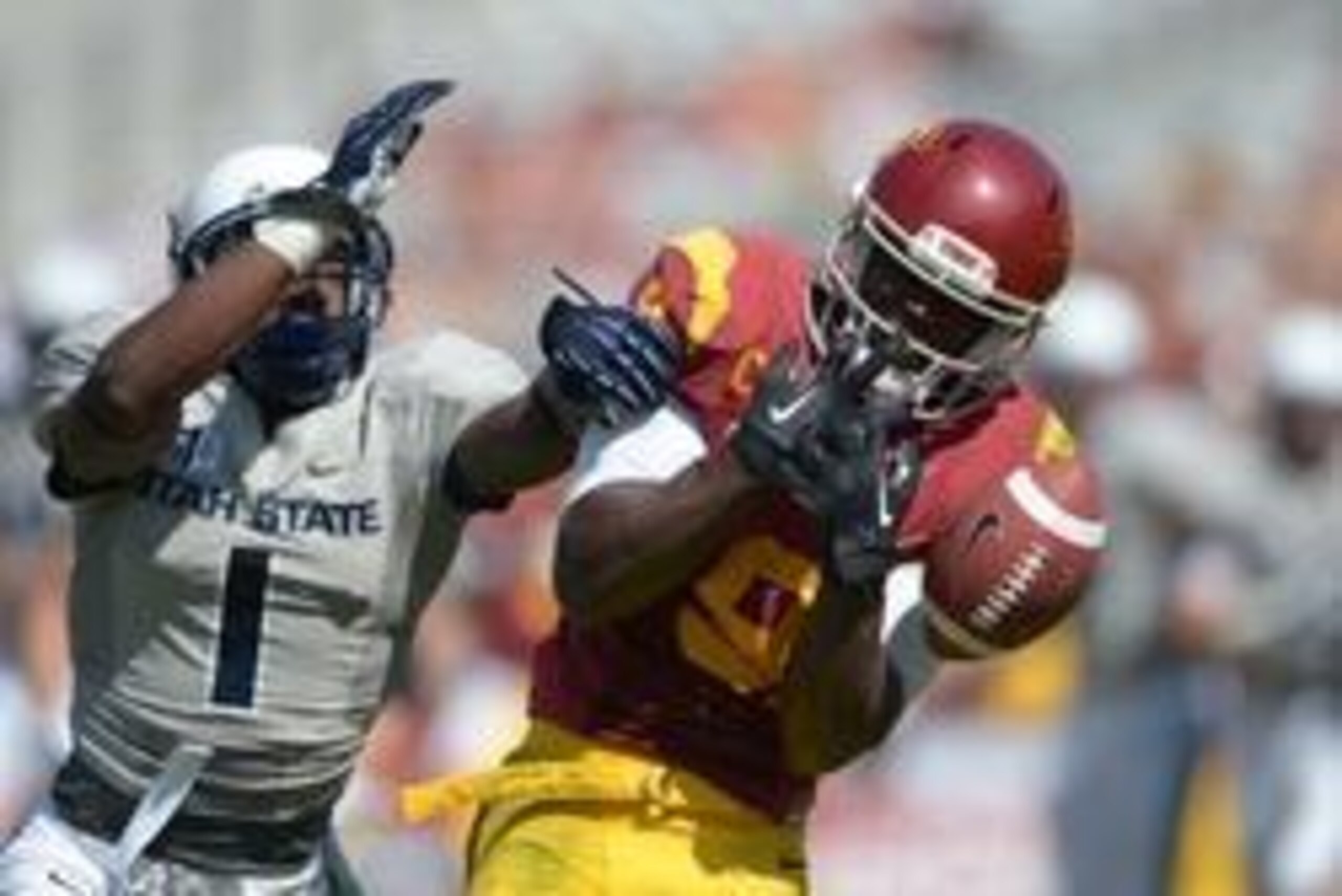 Sep 21, 2013; Los Angeles, CA, USA; Southern California Trojans receiver Marqise Lee (9) is defended by Utah State Aggies cornerback Daniel Gray (1) at the Los Angeles Memorial Coliseum. USC defeated Utah State 17-14. Mandatory Credit: Kirby Lee-USA TODAY