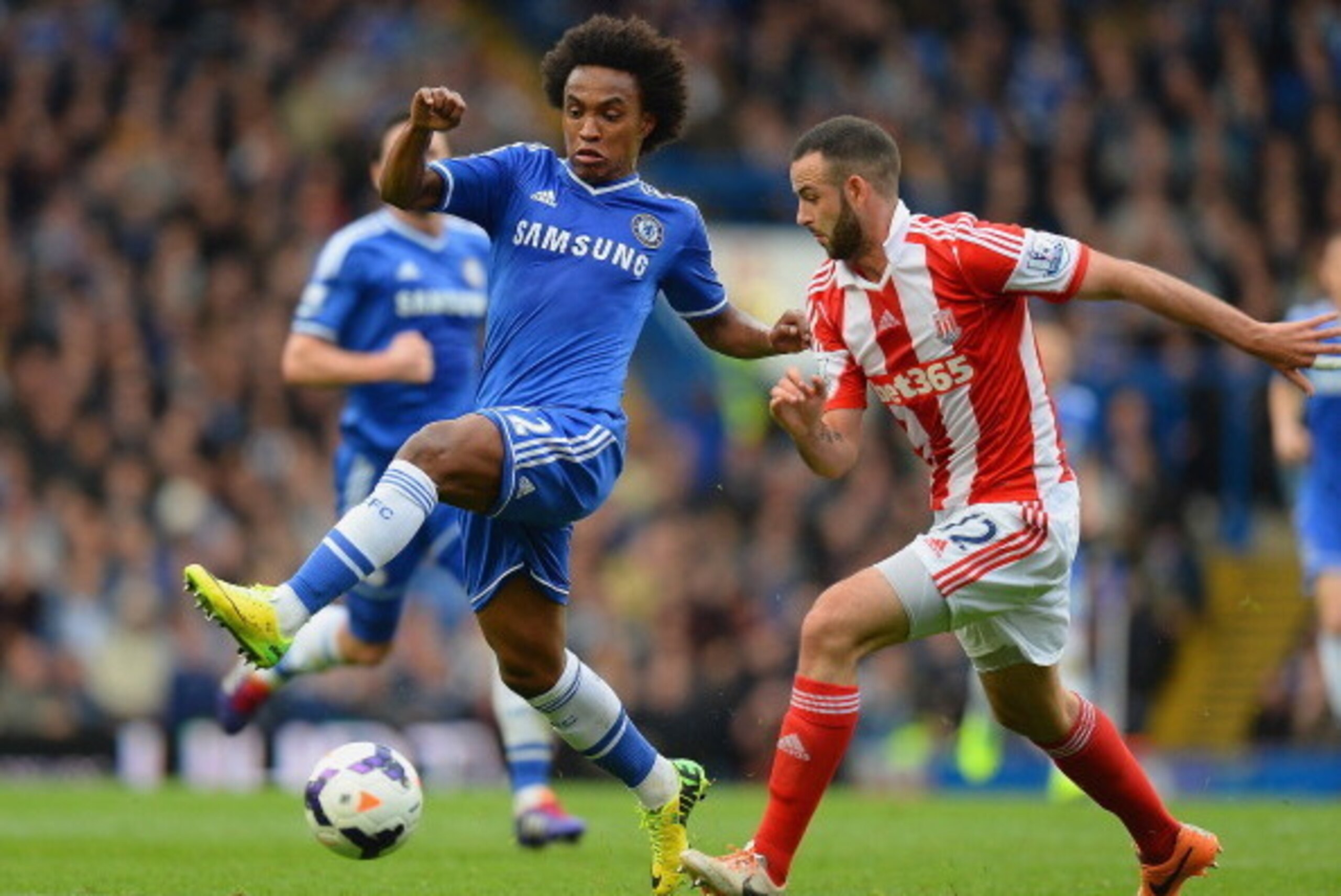 LONDON, ENGLAND - APRIL 05:  Marc Wilson of Stoke City closes down Willian of Chelsea during the Barclays Premier League match between Chelsea and Stoke City at Stamford Bridge on April 5, 2014 in London, England.  (Photo by Mike Hewitt/Getty Images)