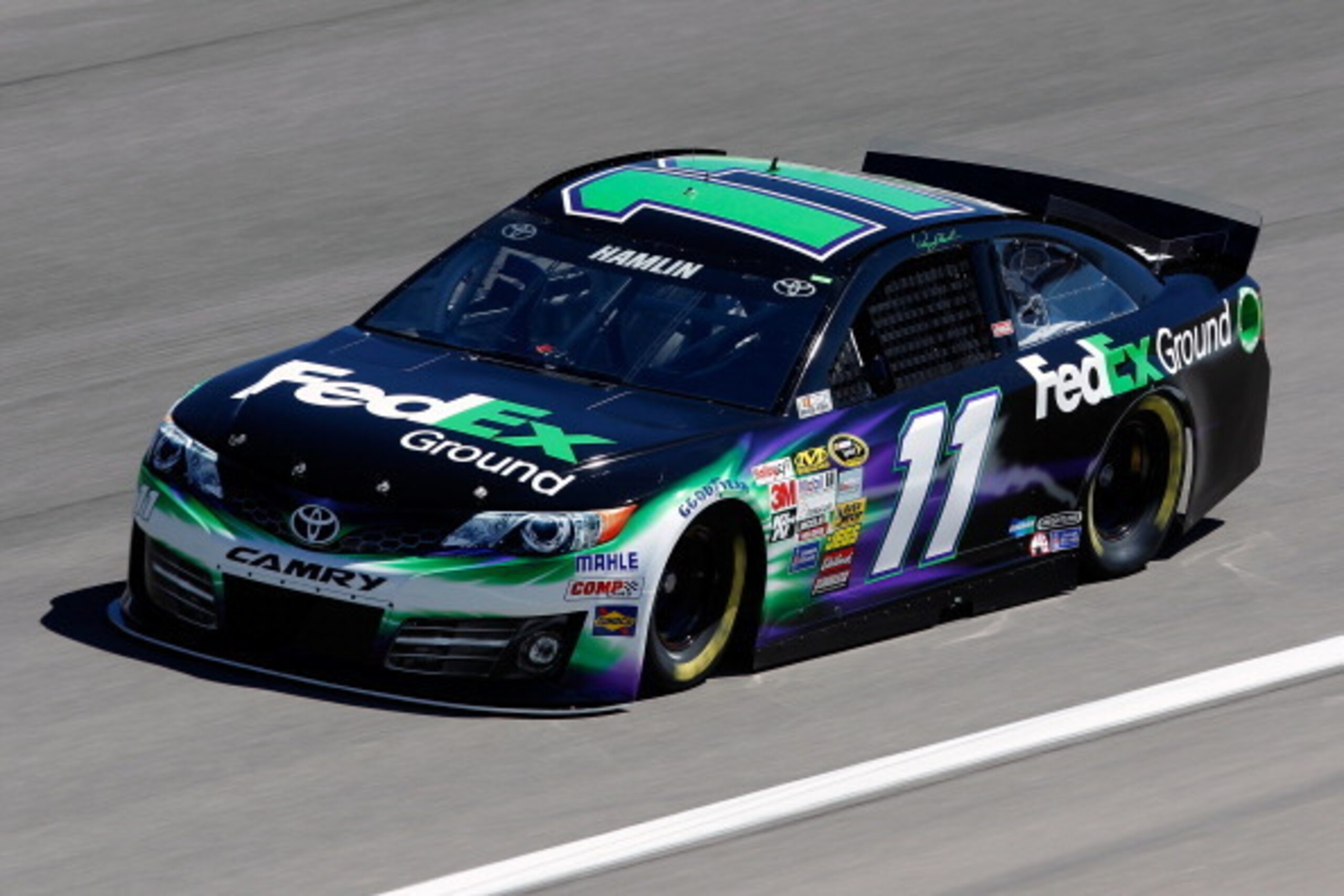 LAS VEGAS, NV - MARCH 07:  Denny Hamlin, driver of the #11 FedEx Ground Toyota, practices for the NASCAR Sprint Cup Series Kobalt 400 at Las Vegas Motor Speedway on March 7, 2014 in Las Vegas, Nevada.  (Photo by Brian Lawdermilk/Getty Images)