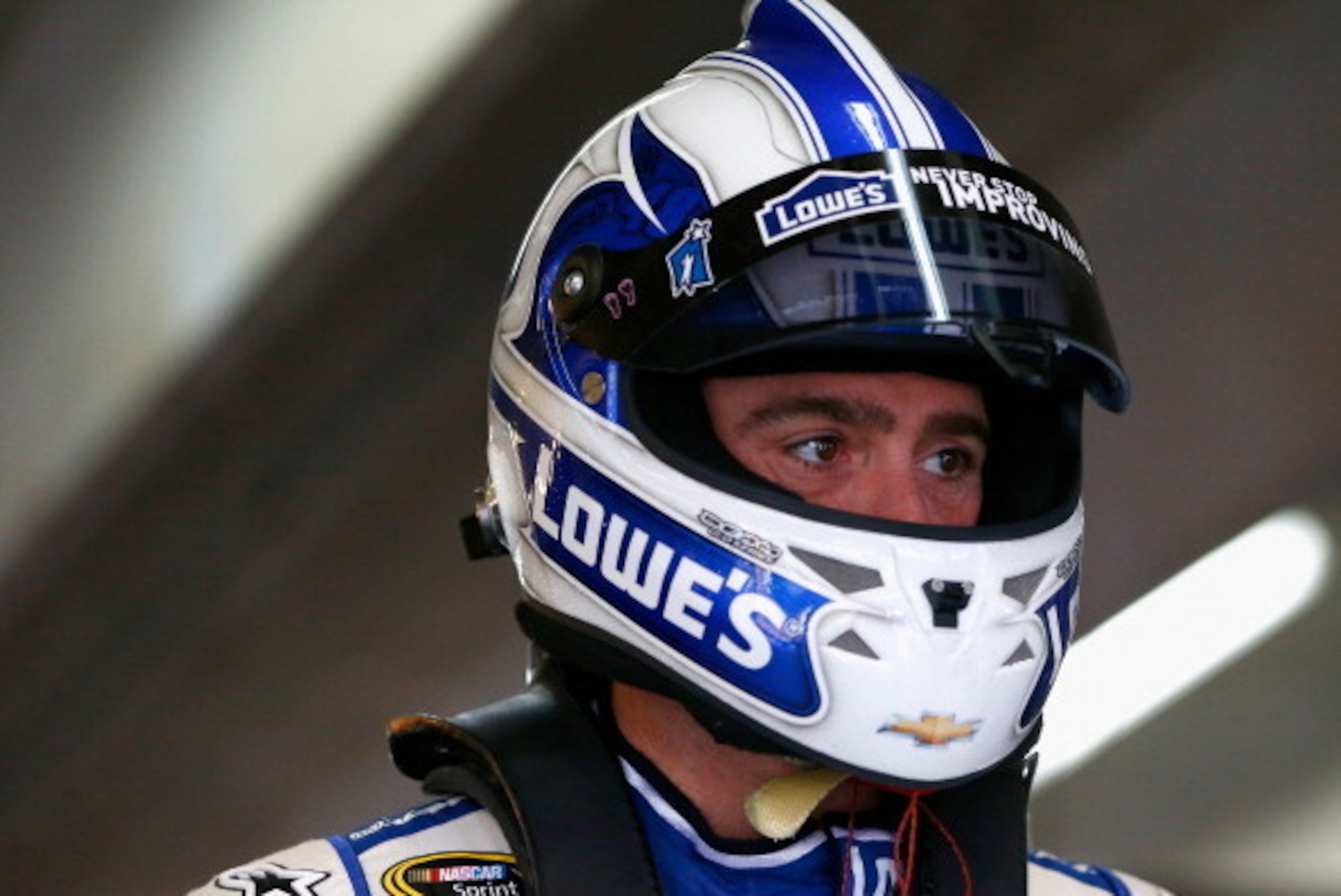 FORT WORTH, TX - APRIL 05:  Jimmie Johnson, driver of the #48 Lowe's Spring is Calling Chevrolet, stands in the garage area during practice for the NASCAR Sprint Cup Series Duck Commander 500 at Texas Motor Speedway on April 5, 2014 in Fort Worth, Texas. 