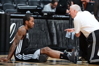 SAN ANTONIO, TX - JUNE 12: Kawhi Leonard and Gregg Popovich, head coach of the San Antonio Spurs warm up at practice as part of the 2013 NBA Finals on June 12, 2013 at AT&T Center in San Antonio, Texas. NOTE TO USER: User expressly acknowledges and agrees