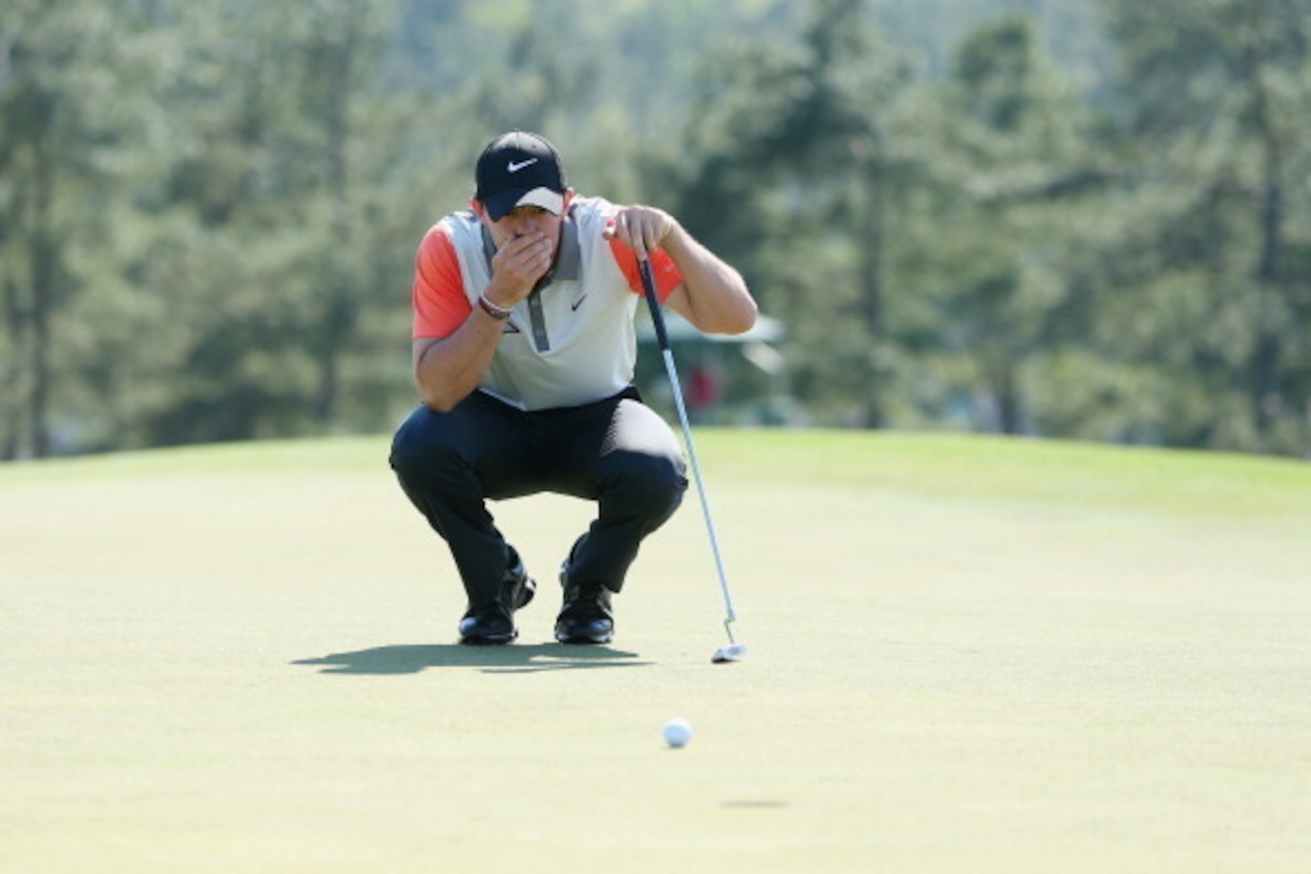 AUGUSTA, GA - APRIL 10:  Rory McIlroy of Northern Ireland lines up a putt on the 18th green during the first round of the 2014 Masters Tournament at Augusta National Golf Club on April 10, 2014 in Augusta, Georgia.  (Photo by Andrew Redington/Getty Images