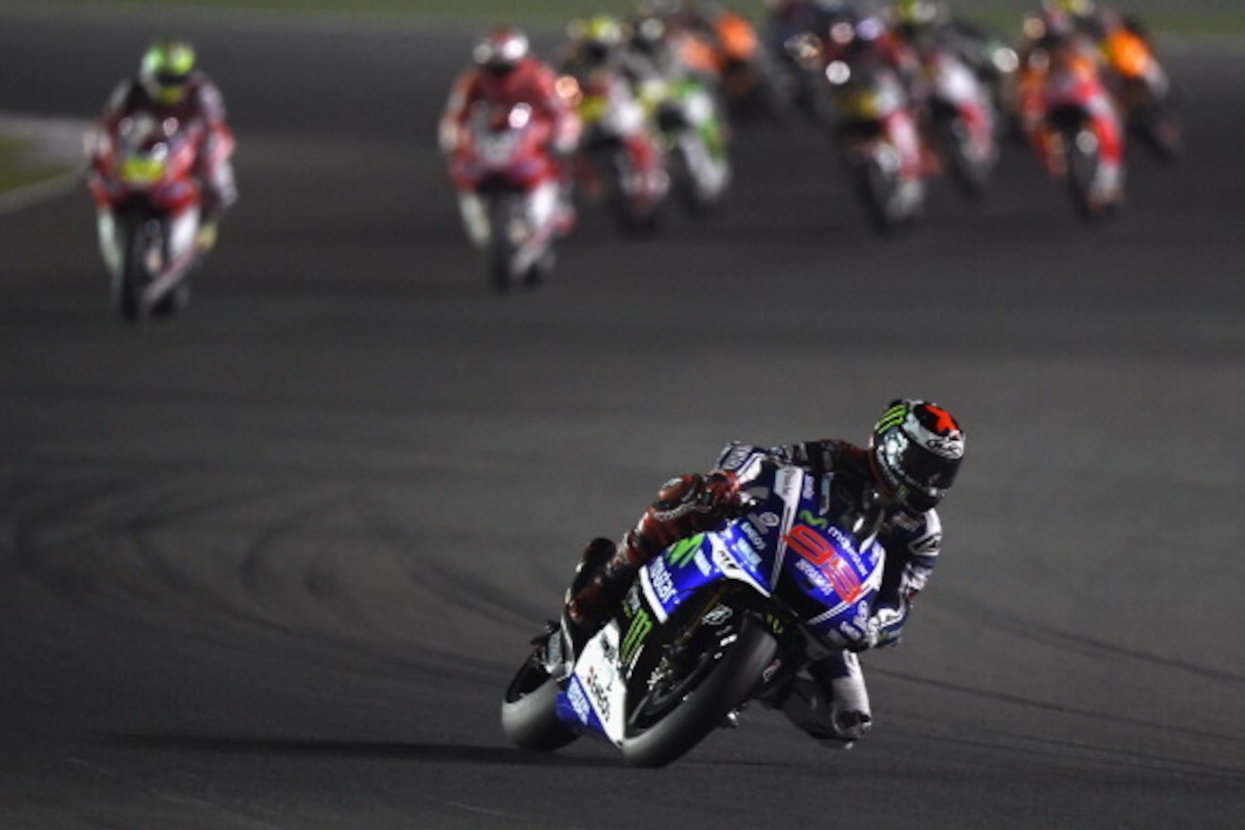DOHA, QATAR - MARCH 23:  Jorge Lorenzo of Spain and Movistar Yamaha MotoGP leads the field during the MotoGP race during the MotoGp of Qatar - Race at Losail Circuit on March 23, 2014 in Doha, Qatar.  (Photo by Mirco Lazzari gp/Getty Images)