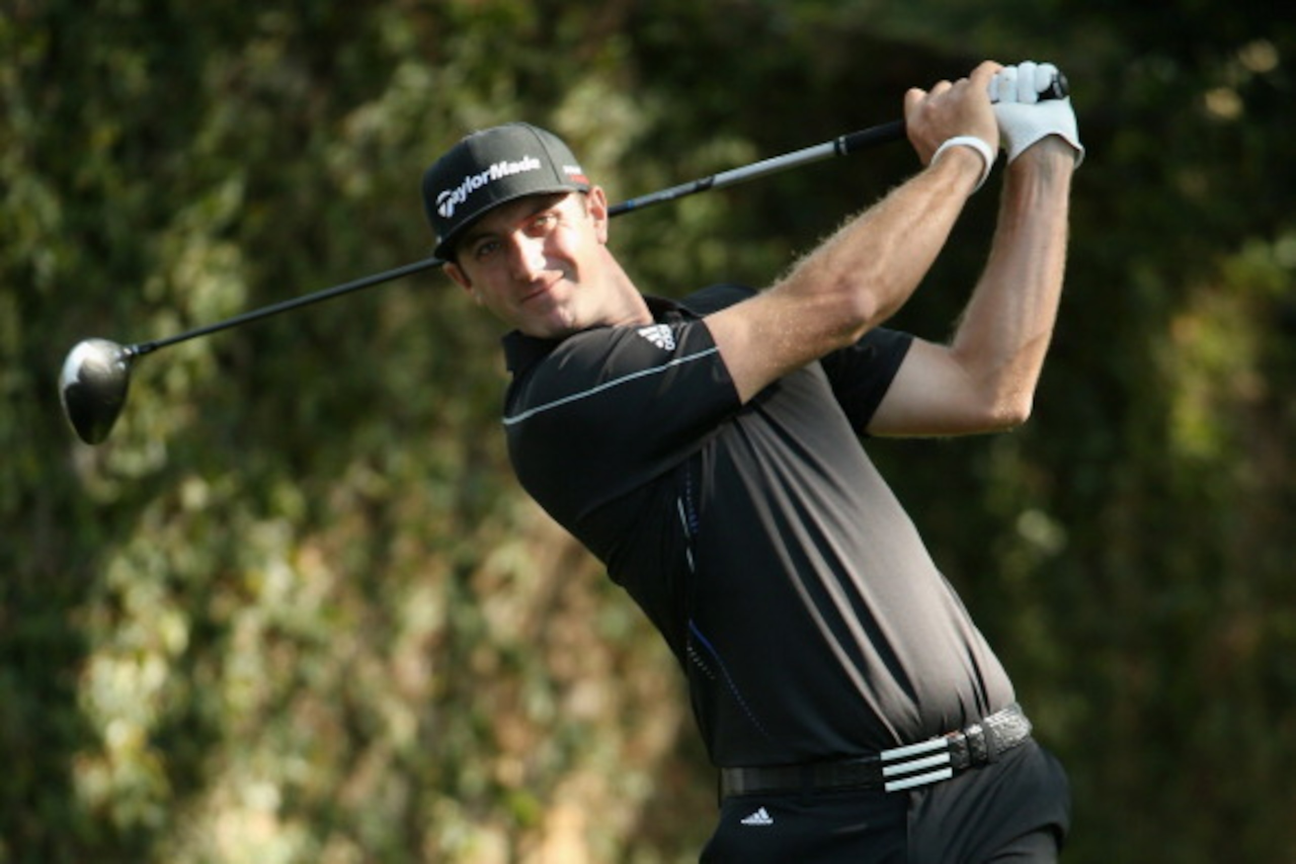 AUGUSTA, GA - APRIL 11:  Dustin Johnson of the United States hits a shot on the second tee during the second round of the 2014 Masters Tournament at Augusta National Golf Club on April 11, 2014 in Augusta, Georgia.  (Photo by Andrew Redington/Getty Images