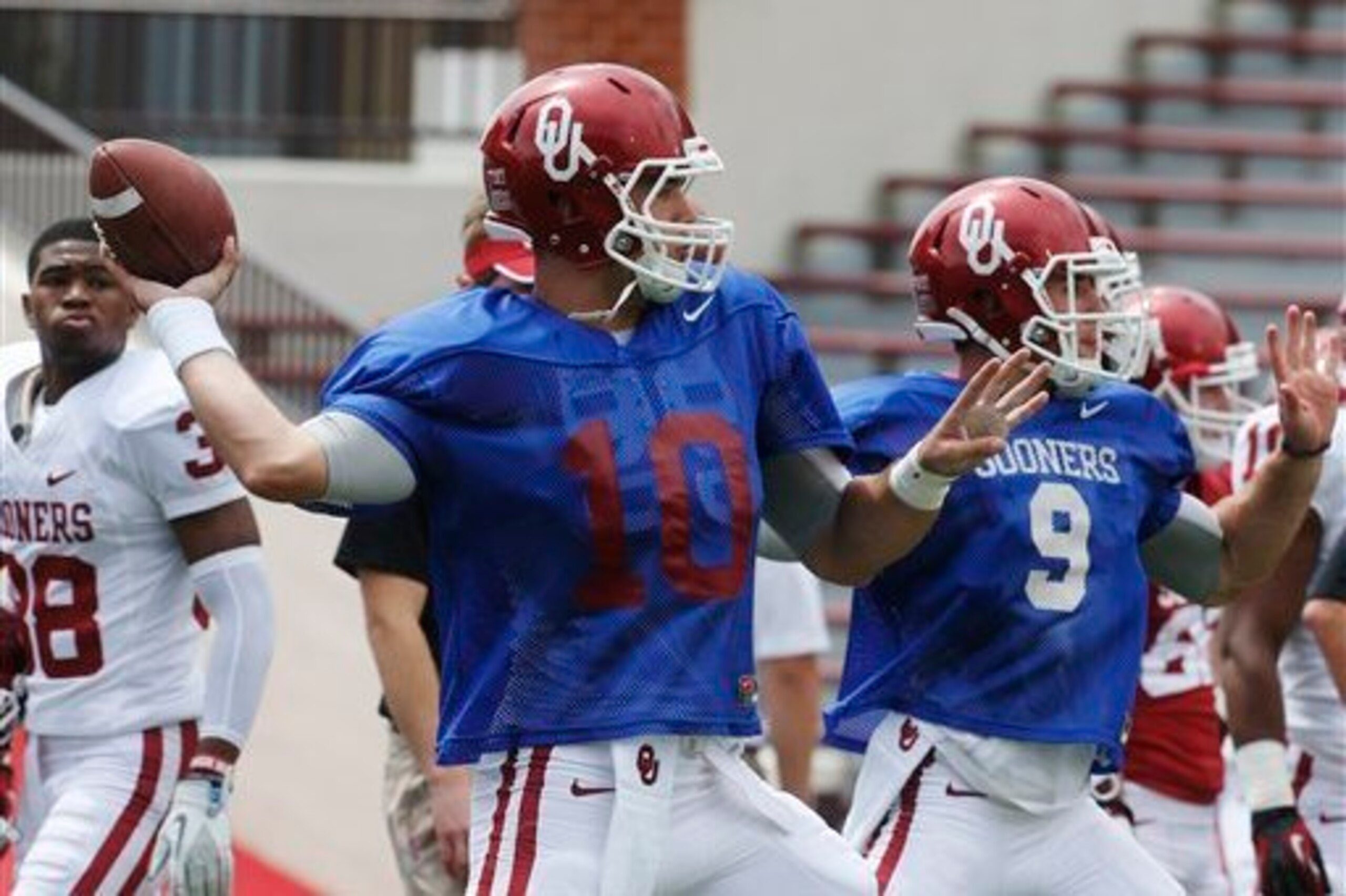 Blake Bell (left) and Trevor Knight (right) duked it out during fall camp in 2013.
