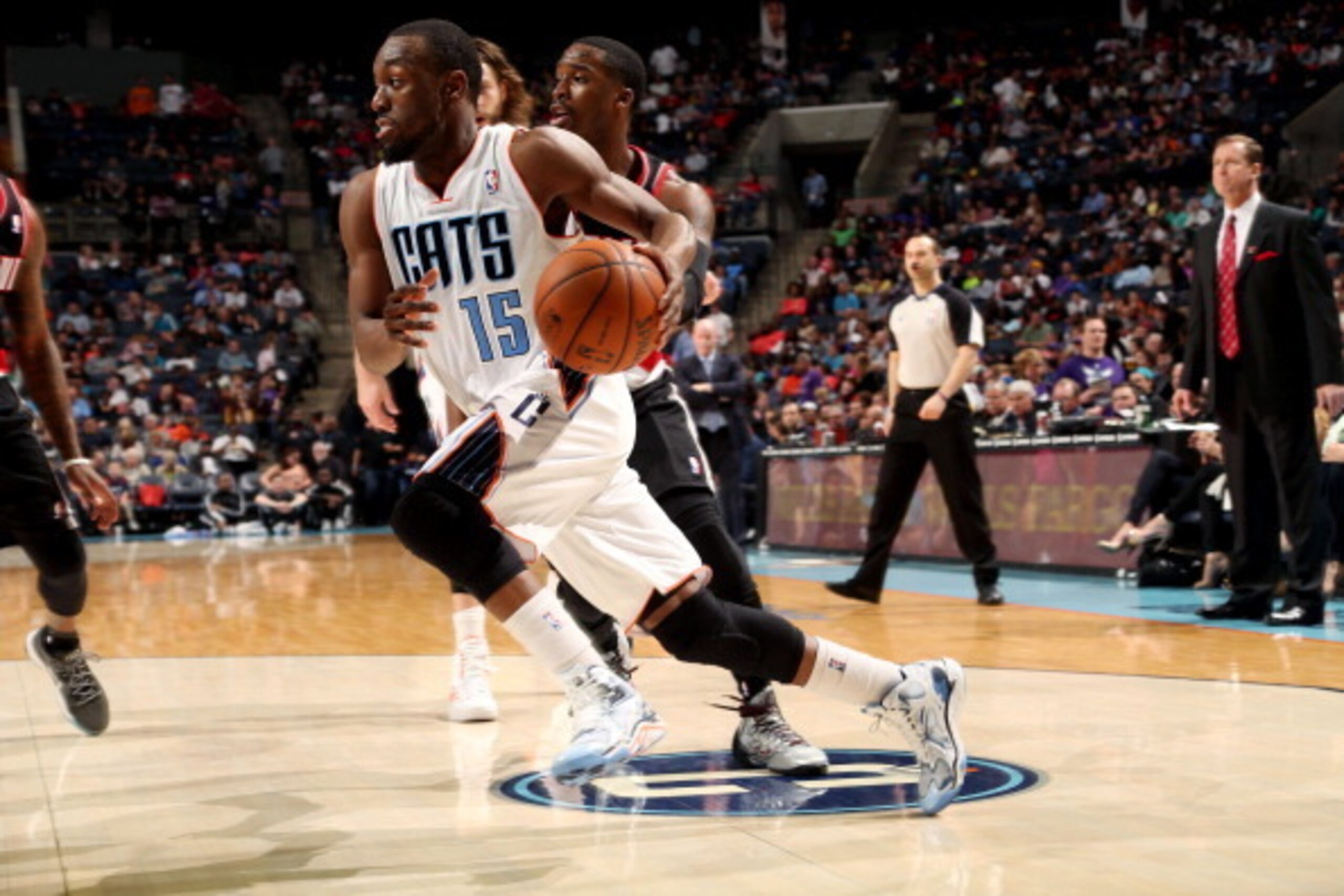 CHARLOTTE, NC - MARCH 22:  Kemba Walker #15 of the Charlotte Bobcats drives against the Portland Trail Blazers at the Time Warner Cable Arena on March 22, 2014 in Charlotte, North Carolina. NOTE TO USER: User expressly acknowledges and agrees that, by dow