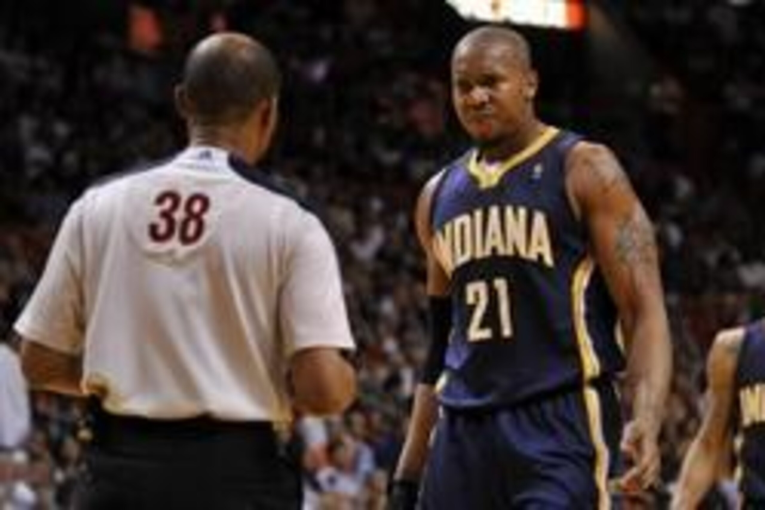 Apr 11, 2014; Miami, FL, USA; Indiana Pacers forward David West (right) talks with referee Michael Smith (left) during the first half against the Miami Heat at American Airlines Arena. Mandatory Credit: Steve Mitchell-USA TODAY Sports