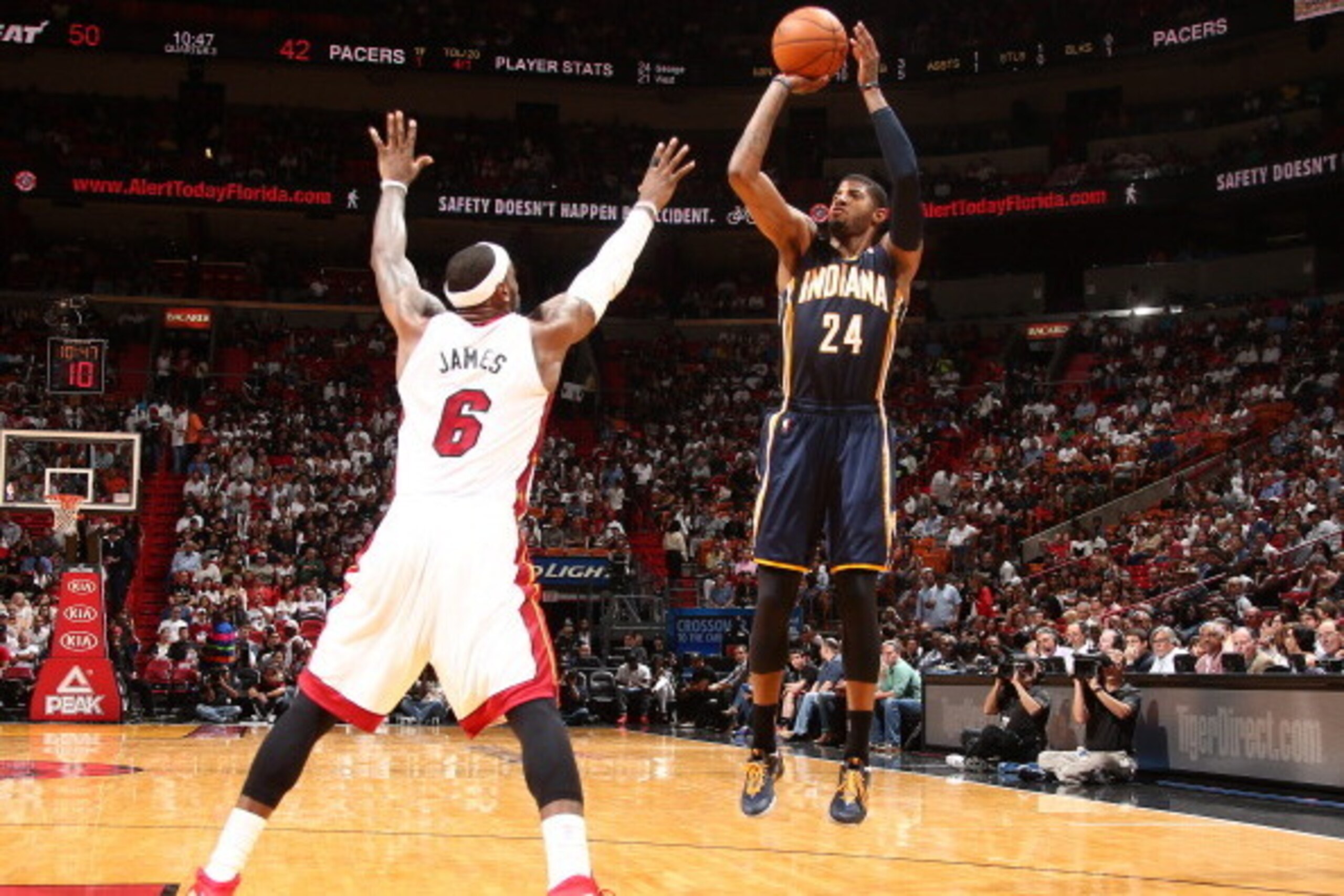 MIAMI, FL - APRIL 11: Paul George #24 of the Indiana Pacers shoots against the Miami Heat during a game on April 11, 2014 at American Airlines Arena in Miami, Florida.  NOTE TO USER: User expressly acknowledges and agrees that, by downloading and or using