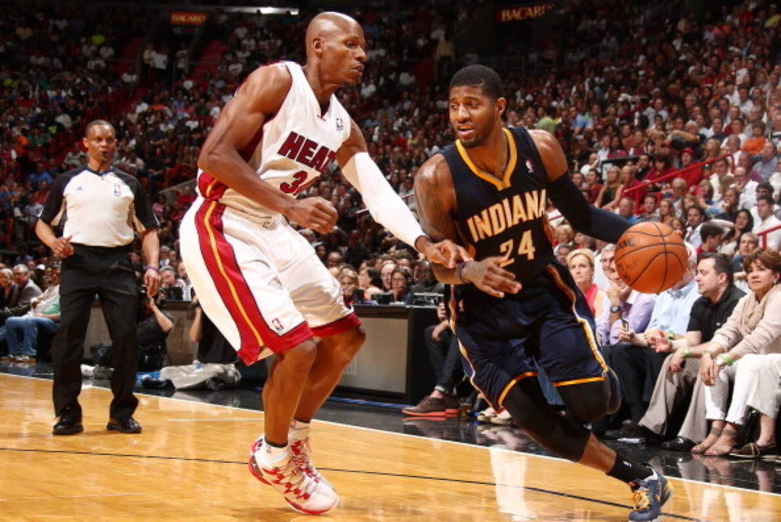 MIAMI, FL - APRIL 11: Paul George #24 of the Indiana Pacers drives against the Miami Heat during a game on April 11, 2014 at American Airlines Arena in Miami, Florida.  NOTE TO USER: User expressly acknowledges and agrees that, by downloading and or using