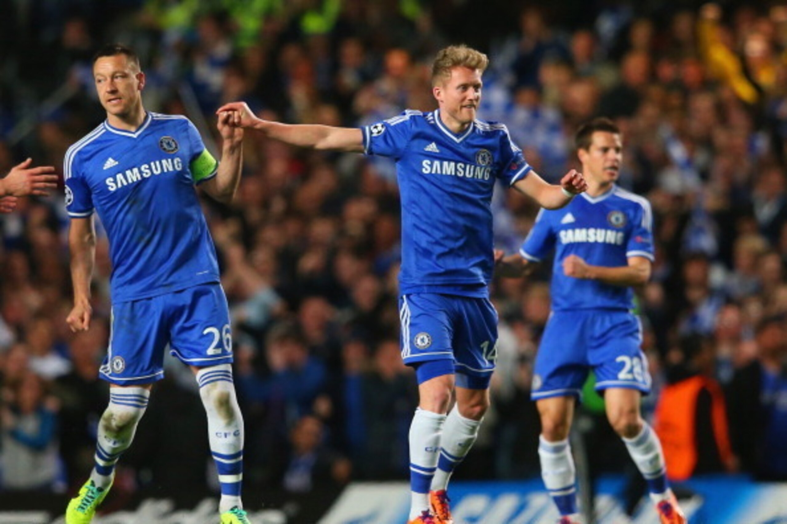 LONDON, ENGLAND - APRIL 08:  John Terry of Chelsea congratulates Andre Schurrle of Chelsea on scoring their first goal during the UEFA Champions League Quarter Final second leg match between Chelsea and Paris Saint-Germain FC at Stamford Bridge on April 8